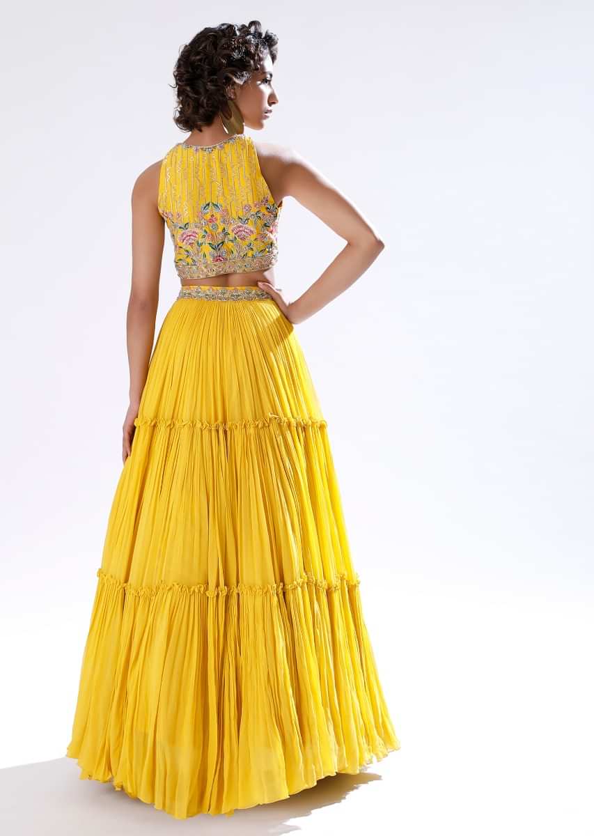 Sun Yellow Lehenga In Crushed Georgette With Halter Neck Crop Top Adorned In Colorful Resham And Cut Dana Work 