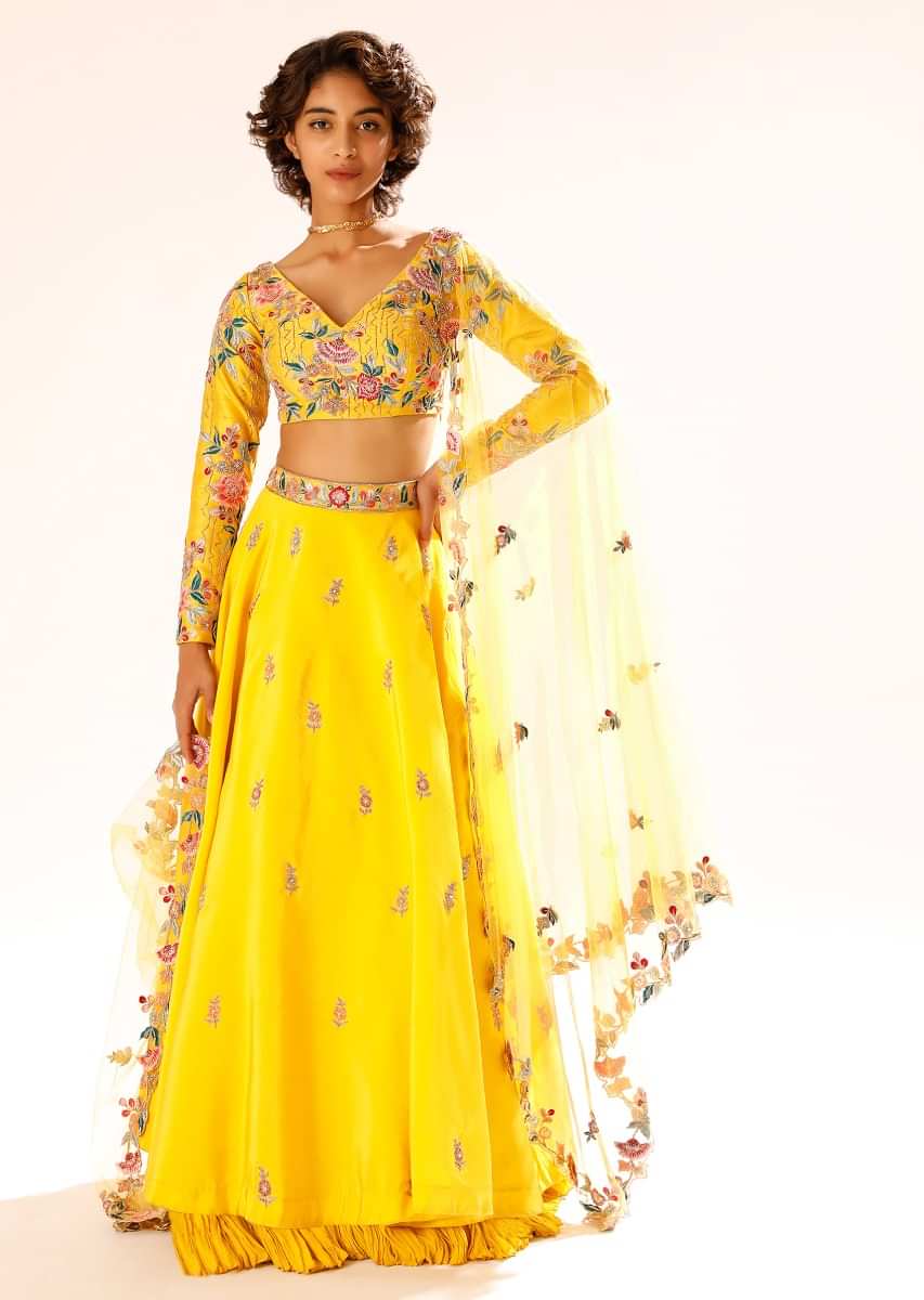 Sun Yellow Lehenga With Hand Embroidered Buttis And Colorful Resham Work In Floral Motifs On The Choli 