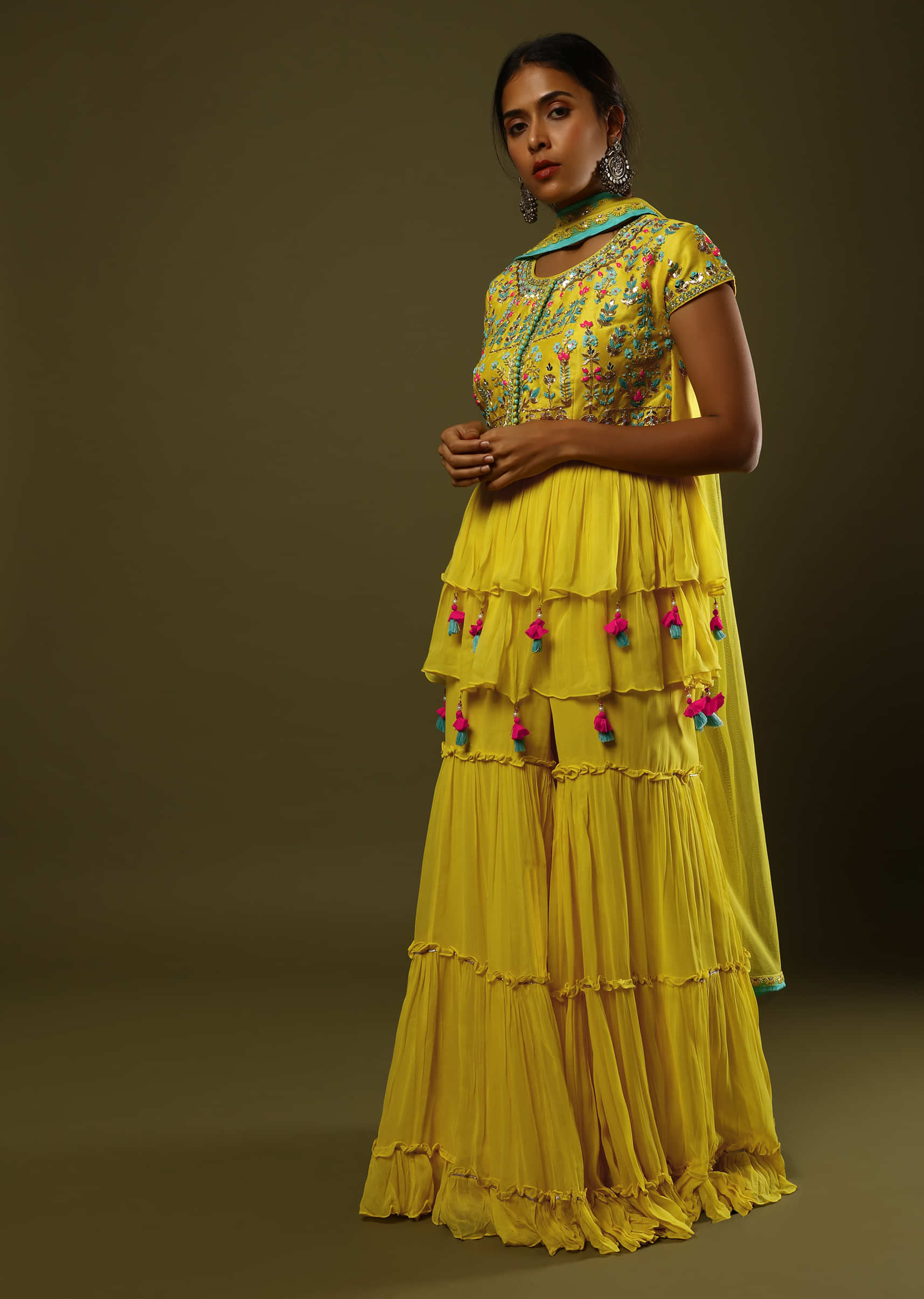 Sun Yellow Sharara And Peplum Suit In Crushed Georgette With Colorful Sequin And Mirror Embroidery Along With Fancy Tassels  
