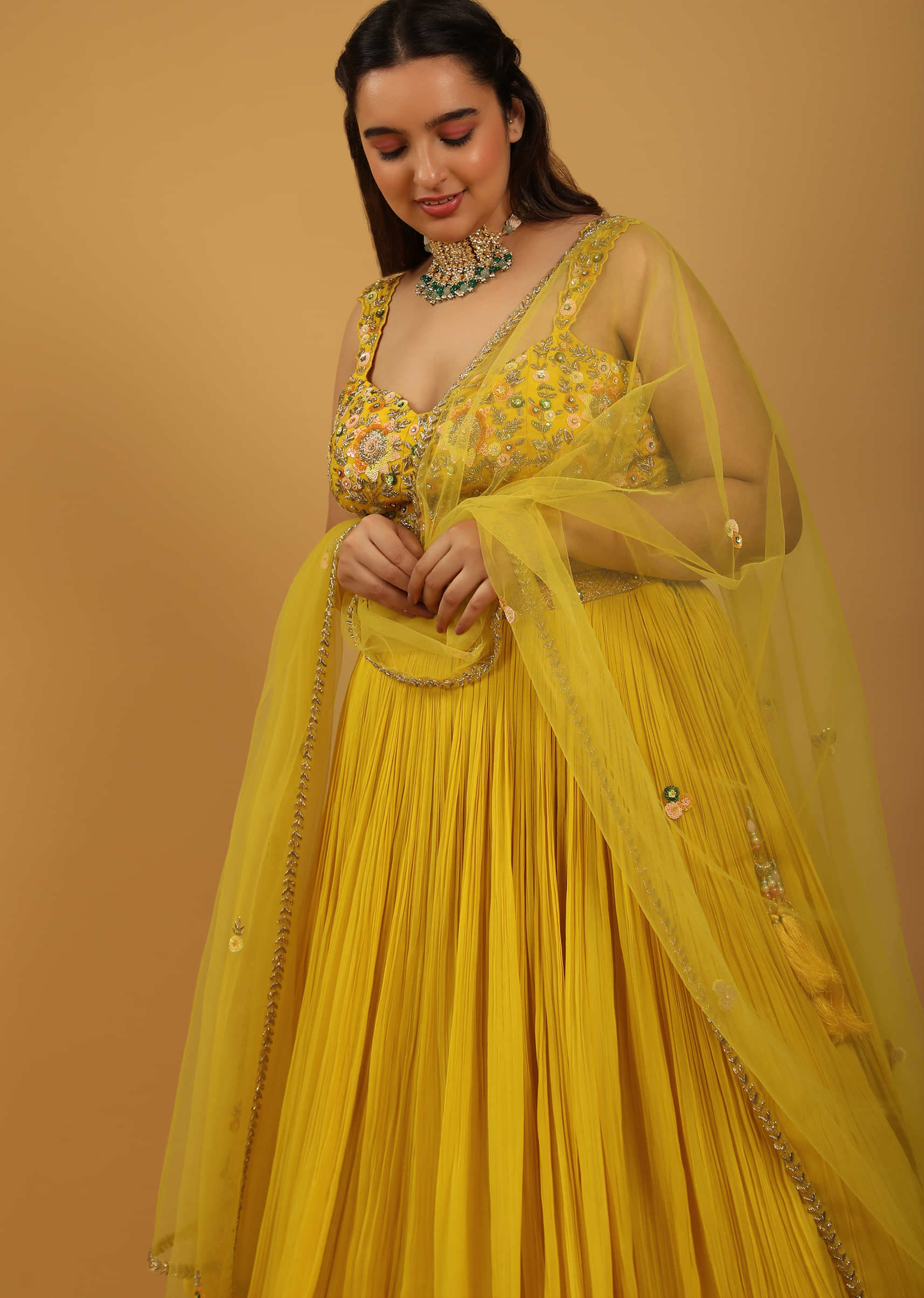 Sun-Yellow Gathered Lehenga With Hand-Embroidered Blouse In Floral Patterns and Sequins