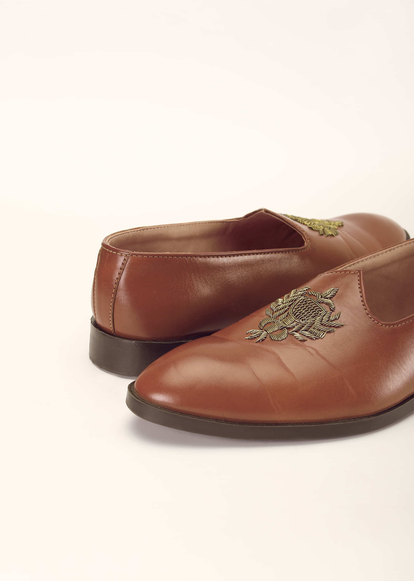 Tan Juttis In Leather With Zari Embroidered Motif