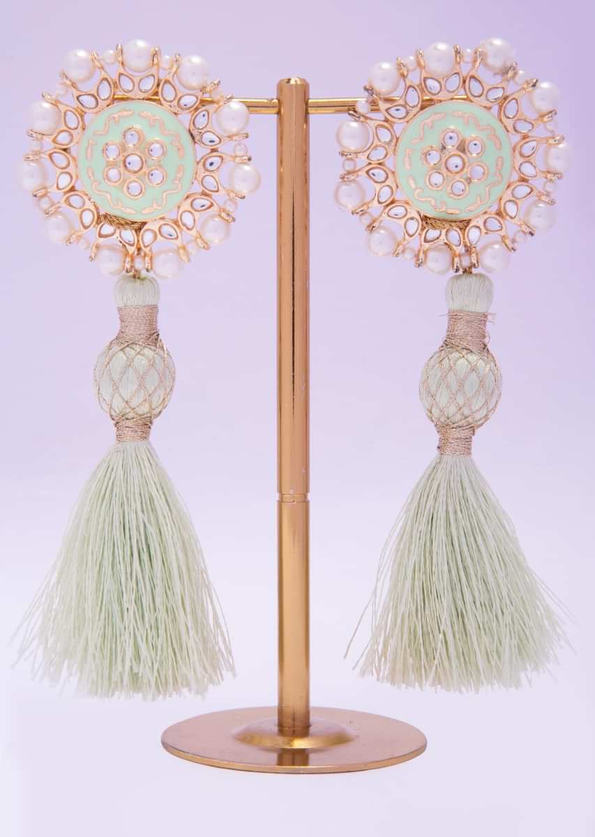 Tasseled cluster earing adorn with pearls and kundan work only on kalki