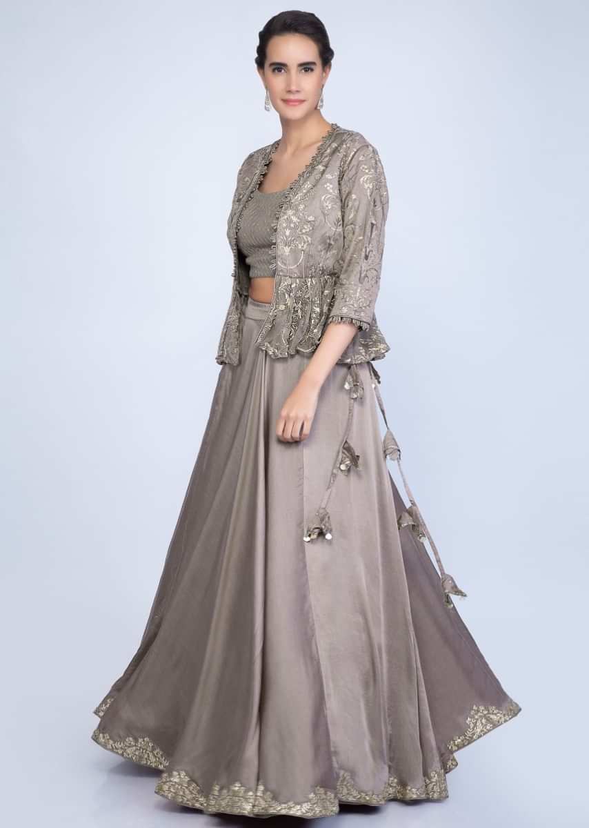 Taupe lehenga and blouse with matching embroidered net dupatta and a fancy jacket only on Kalki
