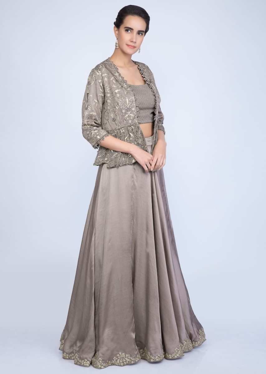 Taupe lehenga and blouse with matching embroidered net dupatta and a fancy jacket only on Kalki