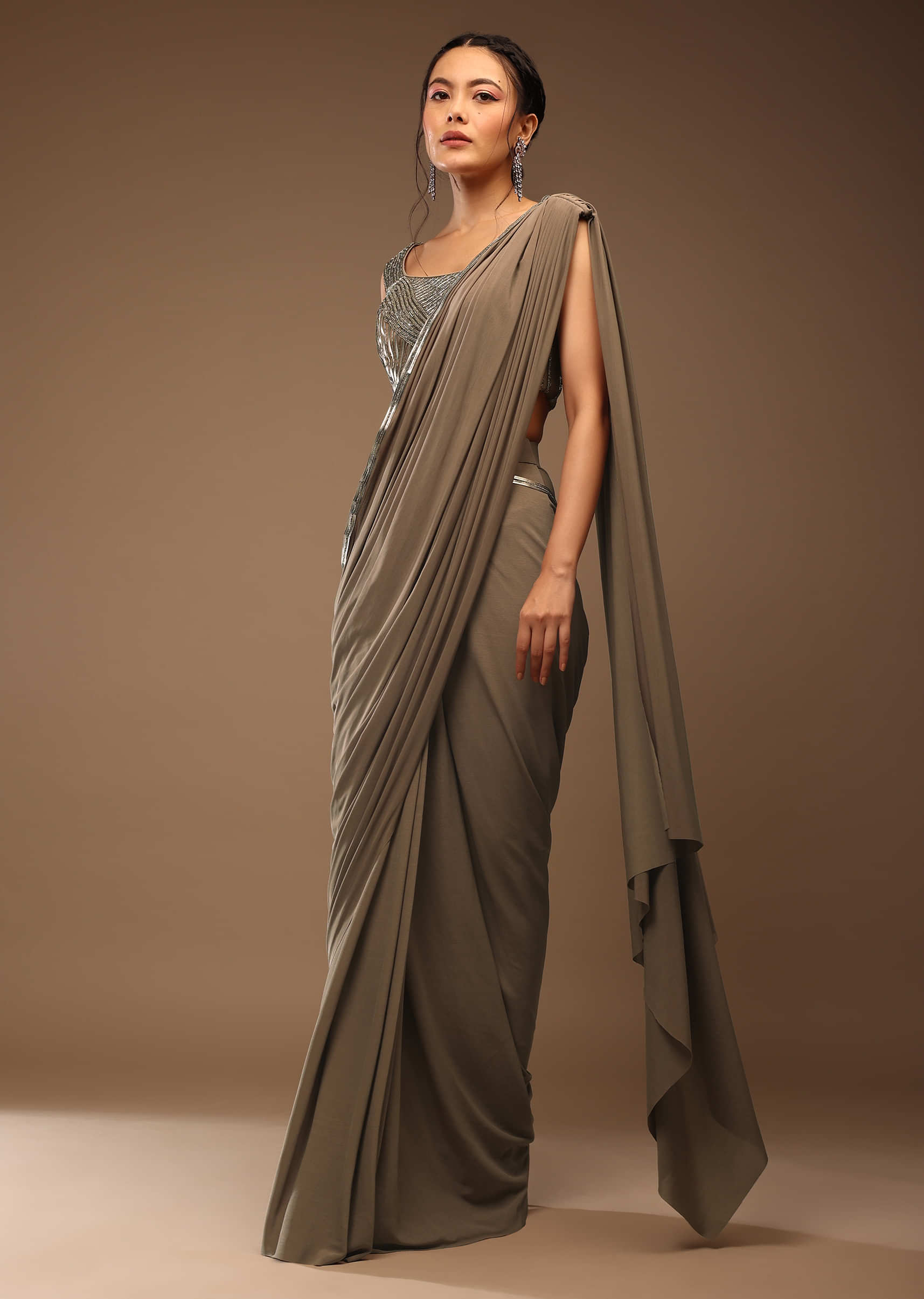 Taupe Grey Ready-Pleated Saree With A Crop Top In Foil Applique Embellishment Sleeveless With A Tie-Up Tassel Dori At The Back.