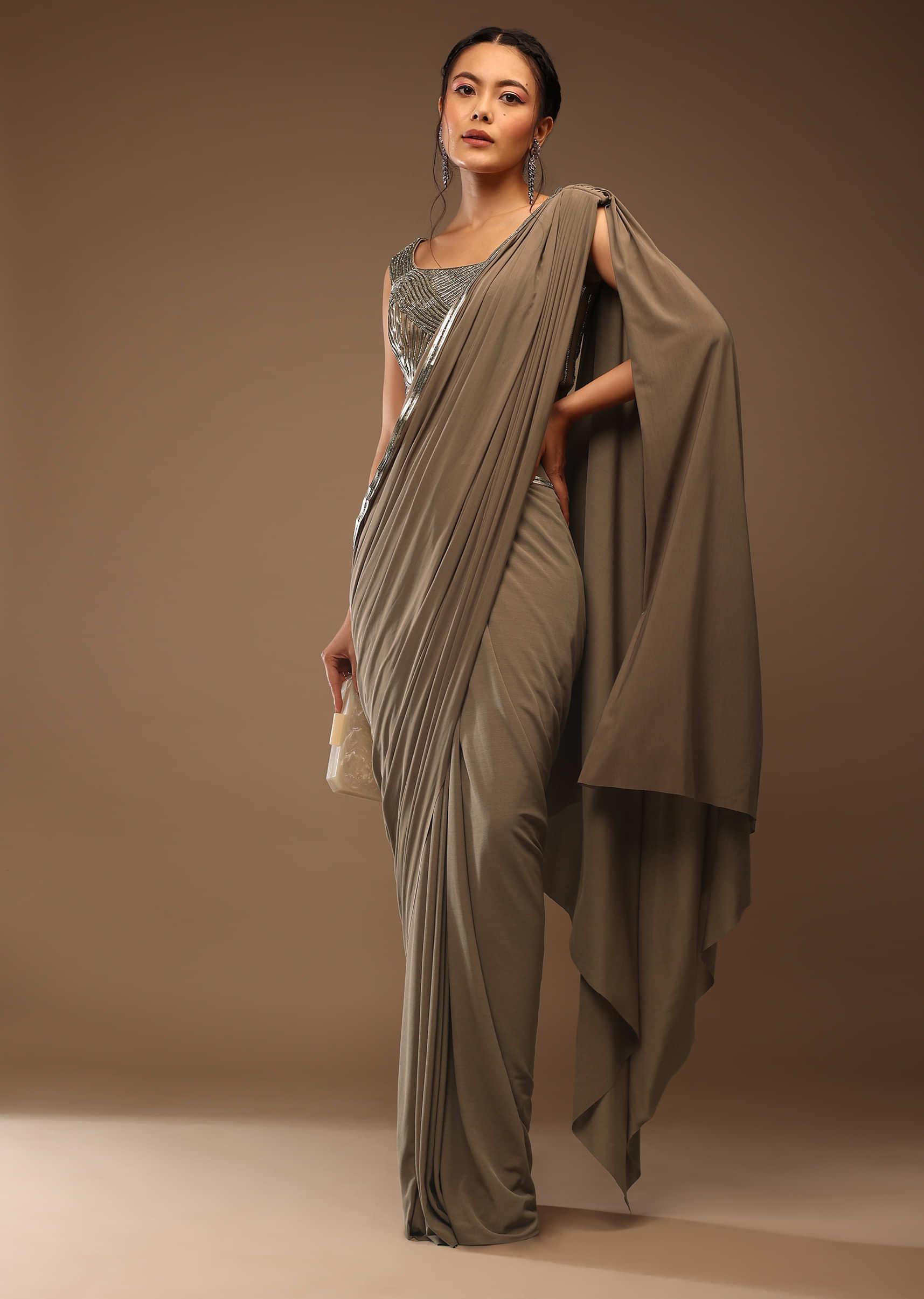 Taupe Grey Ready-Pleated Saree With A Crop Top In Foil Applique Embellishment Sleeveless With A Tie-Up Tassel Dori At The Back.