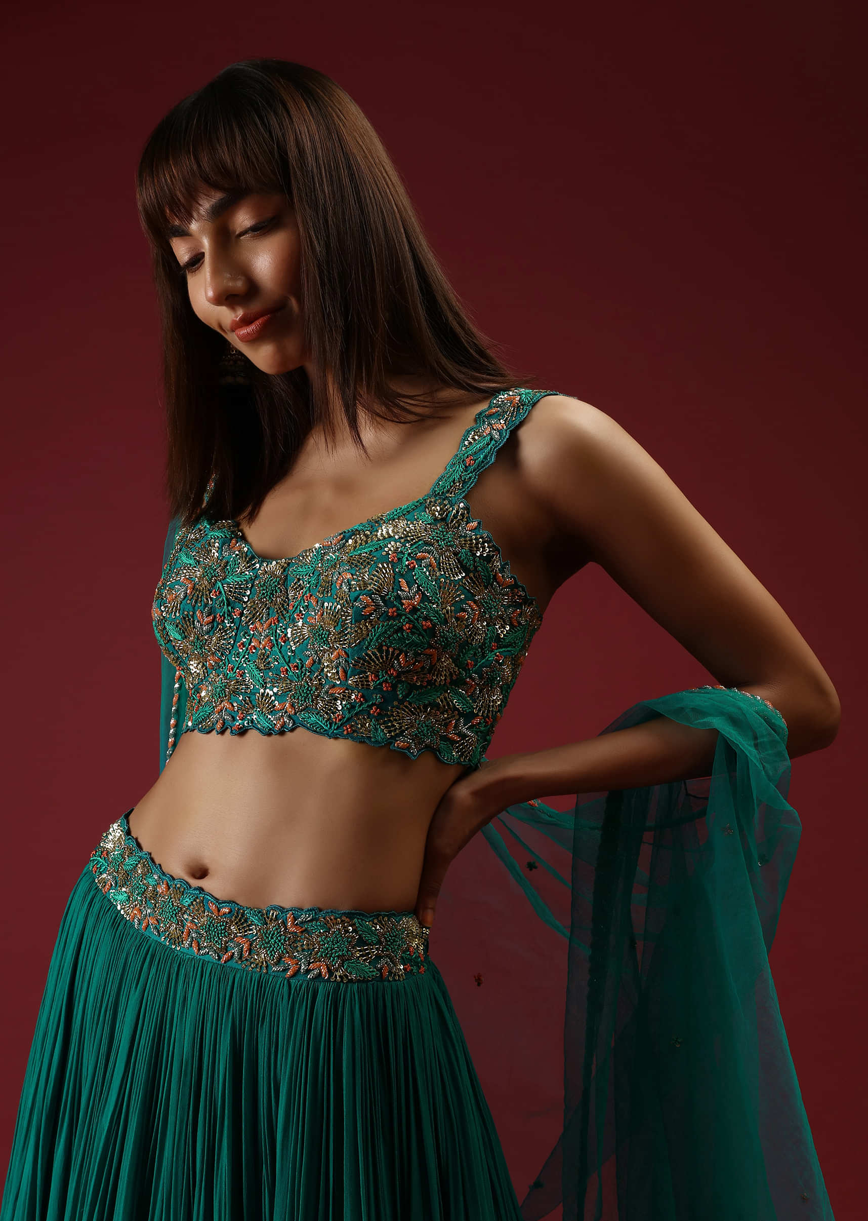 Teal Blue Lehenga Choli With With Multi Colored French Knots And Cut Dana Embroidered Floral Jaal And Matching Cape 