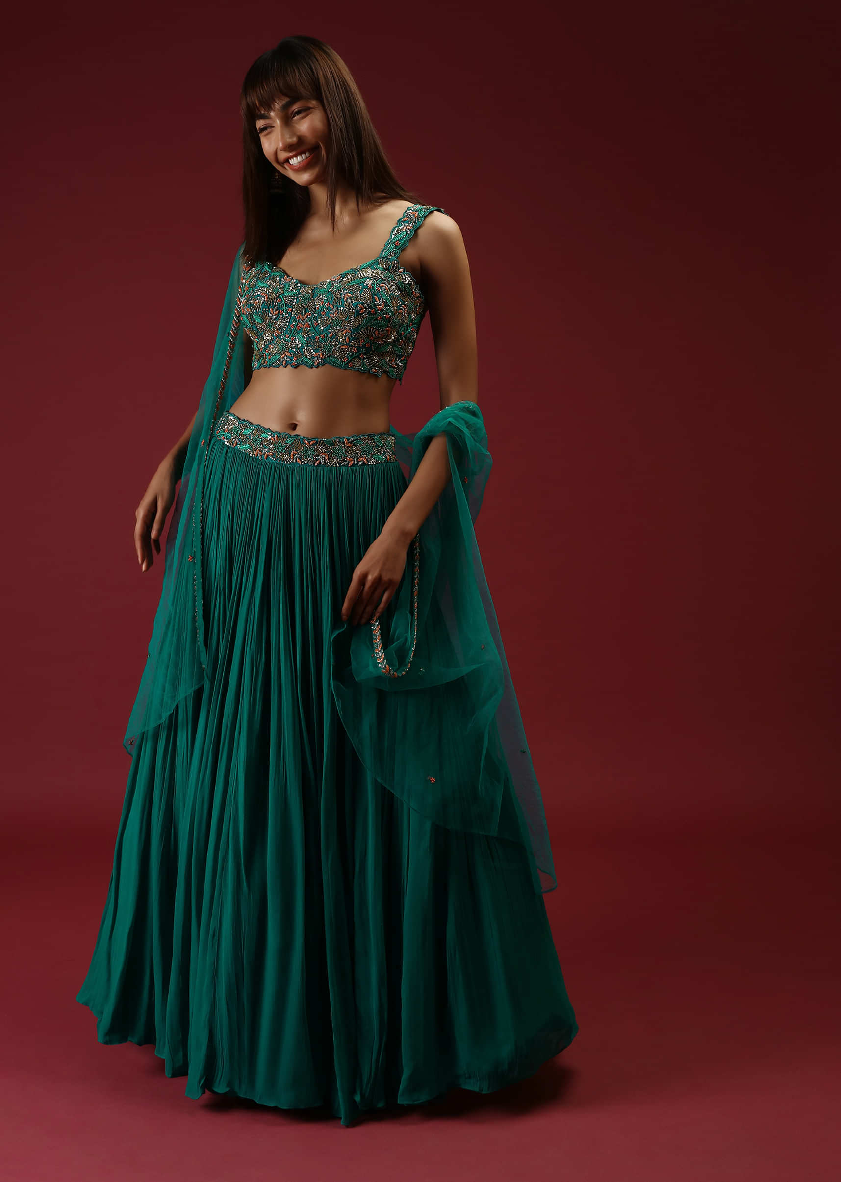 Teal Blue Lehenga Choli With With Multi Colored French Knots And Cut Dana Embroidered Floral Jaal And Matching Cape 