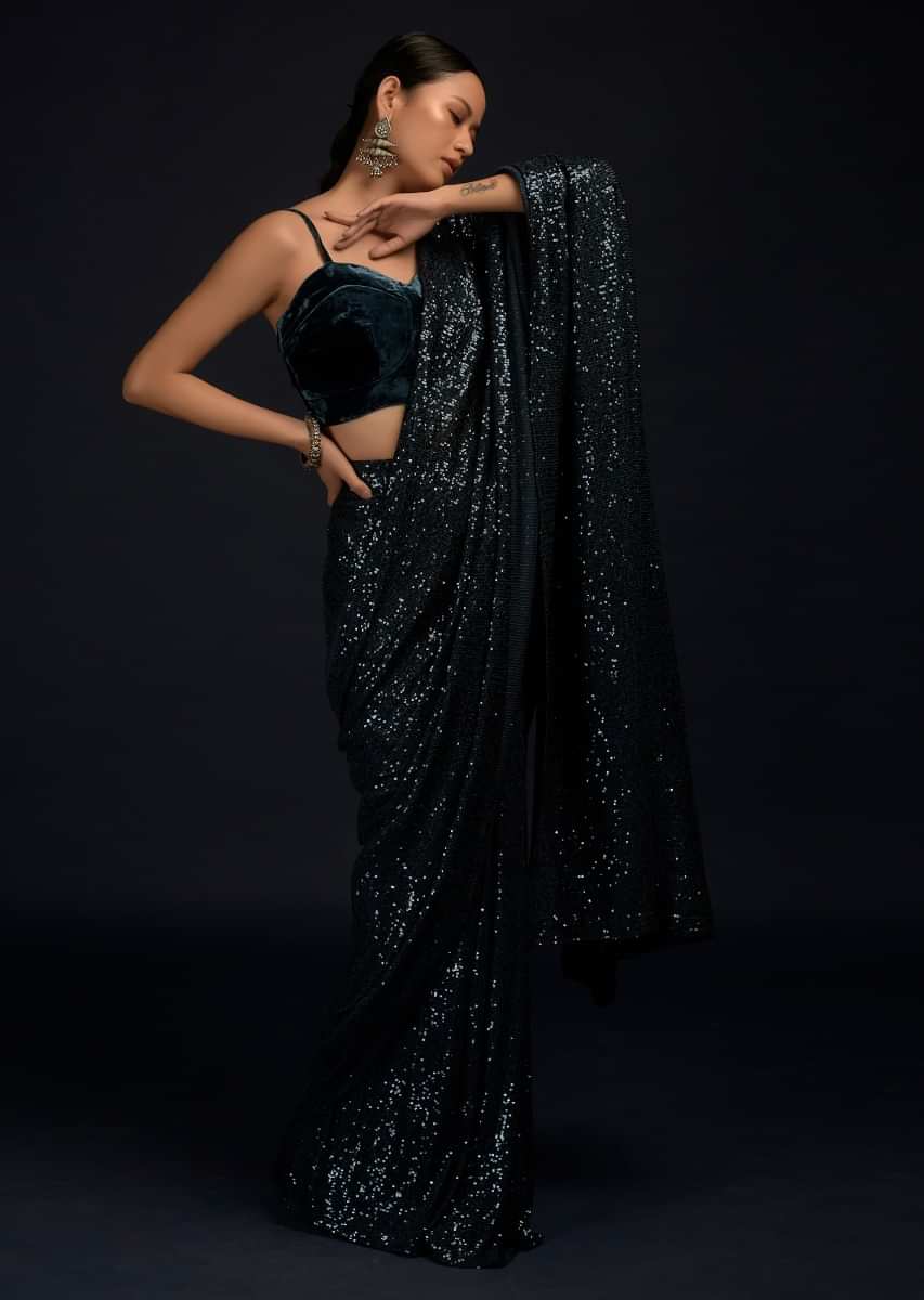 Teal Blue Ready Pleated Saree Embellished In Sequins With A Matching Velvet Blouse With Corset Neckline  