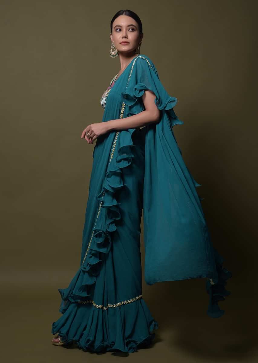 Teal ready pleated saree in georgette with ruffle frill and hand embroidered blouse