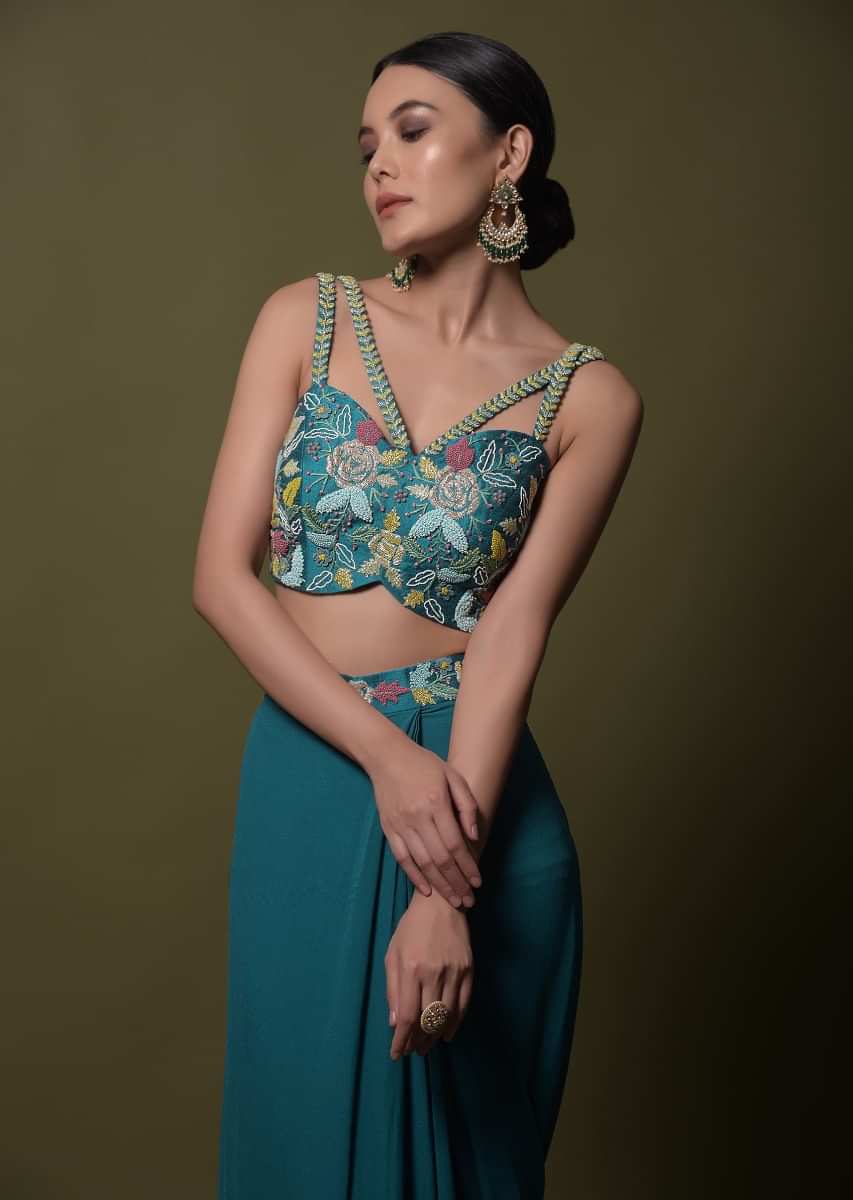 Teal ready pleated saree in georgette with ruffle frill and hand embroidered blouse