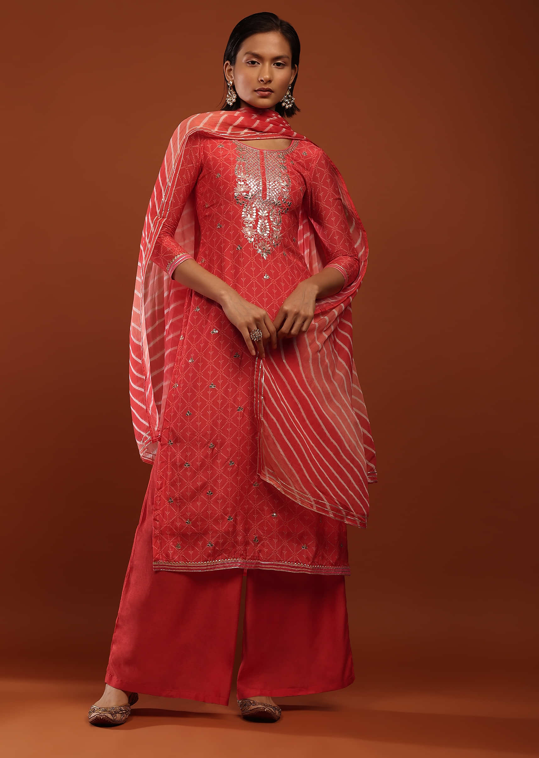 Tomato Red Straight Cut Palazzo Suit With Bandhani Print And Gotta Work On The Yoke And A Lehariya Dupatta