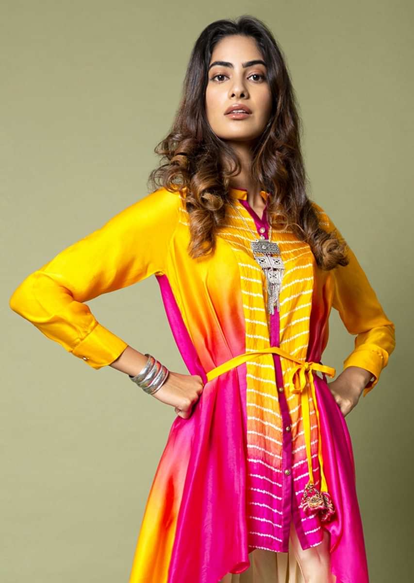 Turmeric Yellow And Hot Pink High Low Shirt With Bandhani And Water Color Effects Paired With Ivory Dhoti Pants  