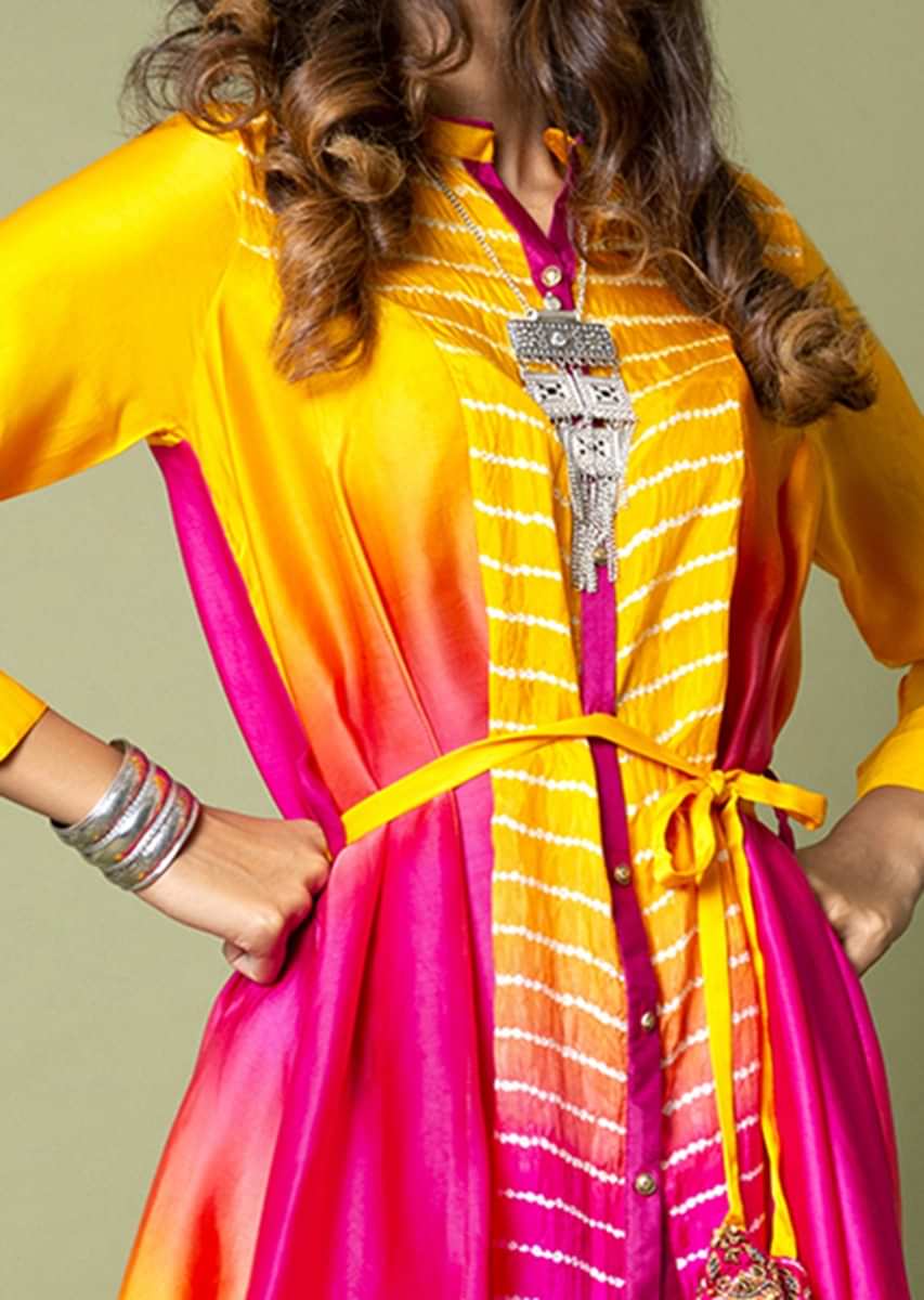 Turmeric Yellow And Hot Pink High Low Shirt With Bandhani And Water Color Effects Paired With Ivory Dhoti Pants  