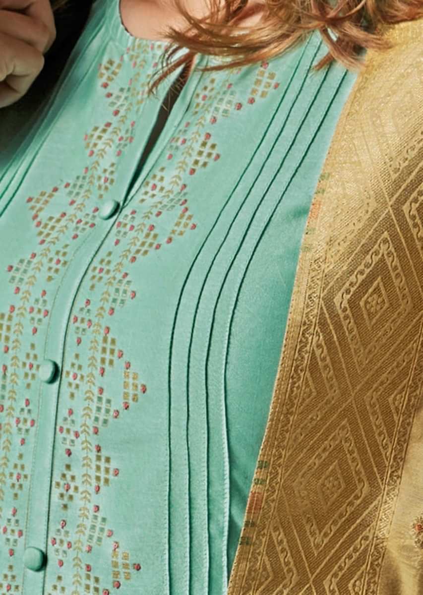 Turq blue unstitched suit adorn in geometric motif printed placket matched with beige dupatta