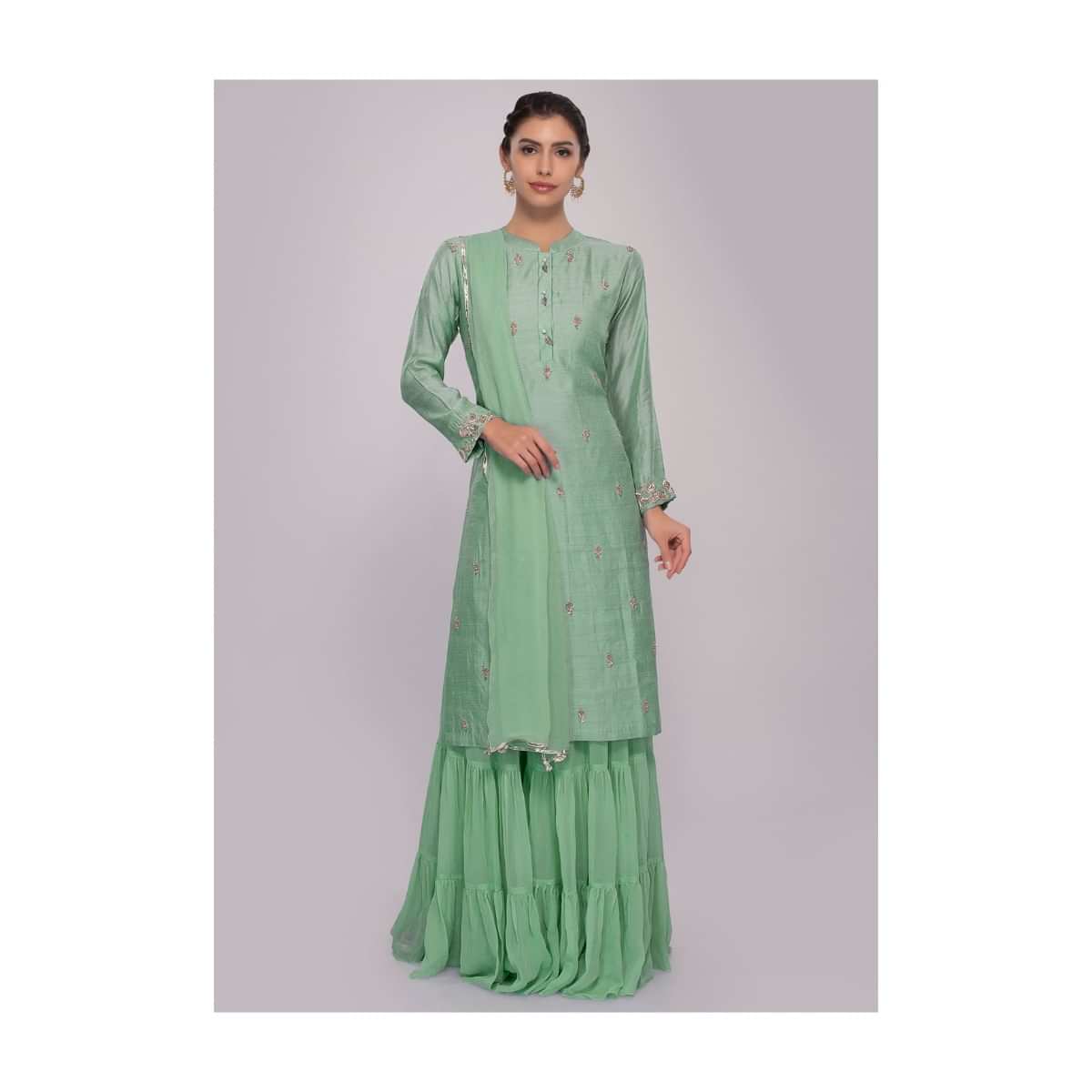 Turq green suit paired with matching sharara pant and chiffon dupatta only on Kalki