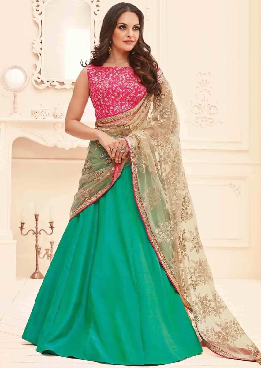 Turq green lehenga in raw silk with pink blouse and beige dupatta in sequin work