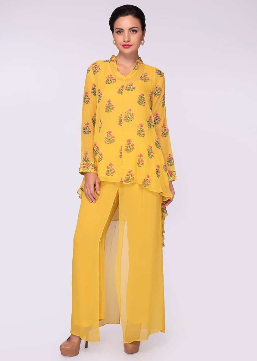 Tuscan yellow asymmetric top in floral printed butti paired with a plain georgette palazzo 