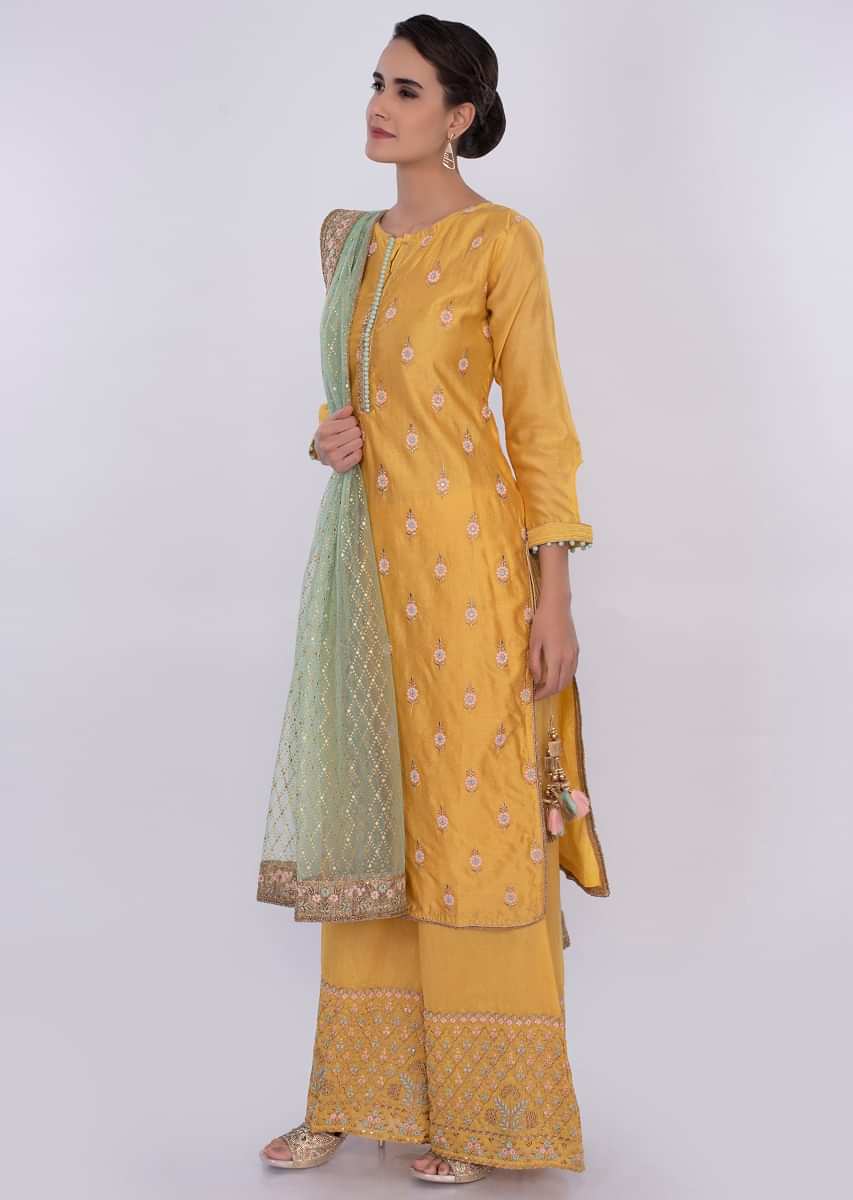 Tuscan yellow cotton silk palazzo suit  wit contrasting green net dupatta only on Kalki