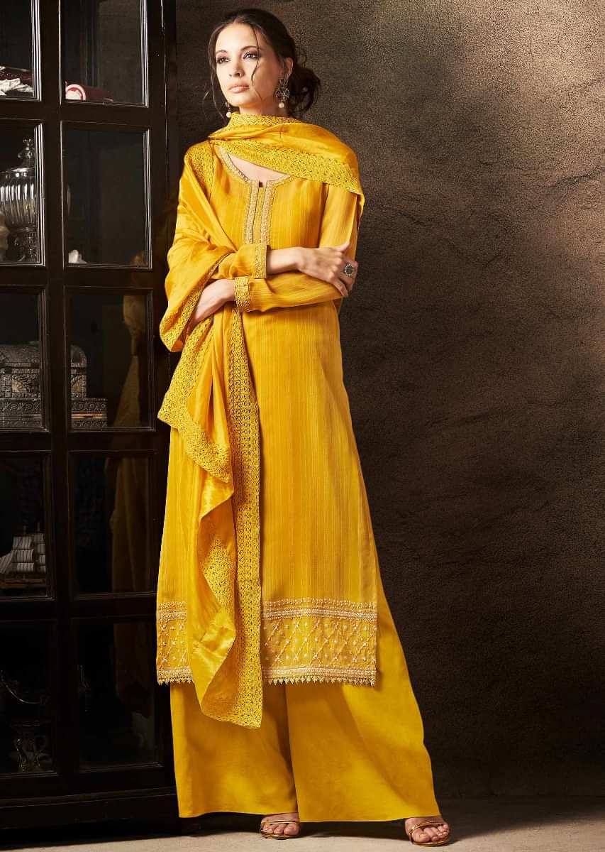 Unstitched suit chrome yellow in resham embroidered placket and hem line