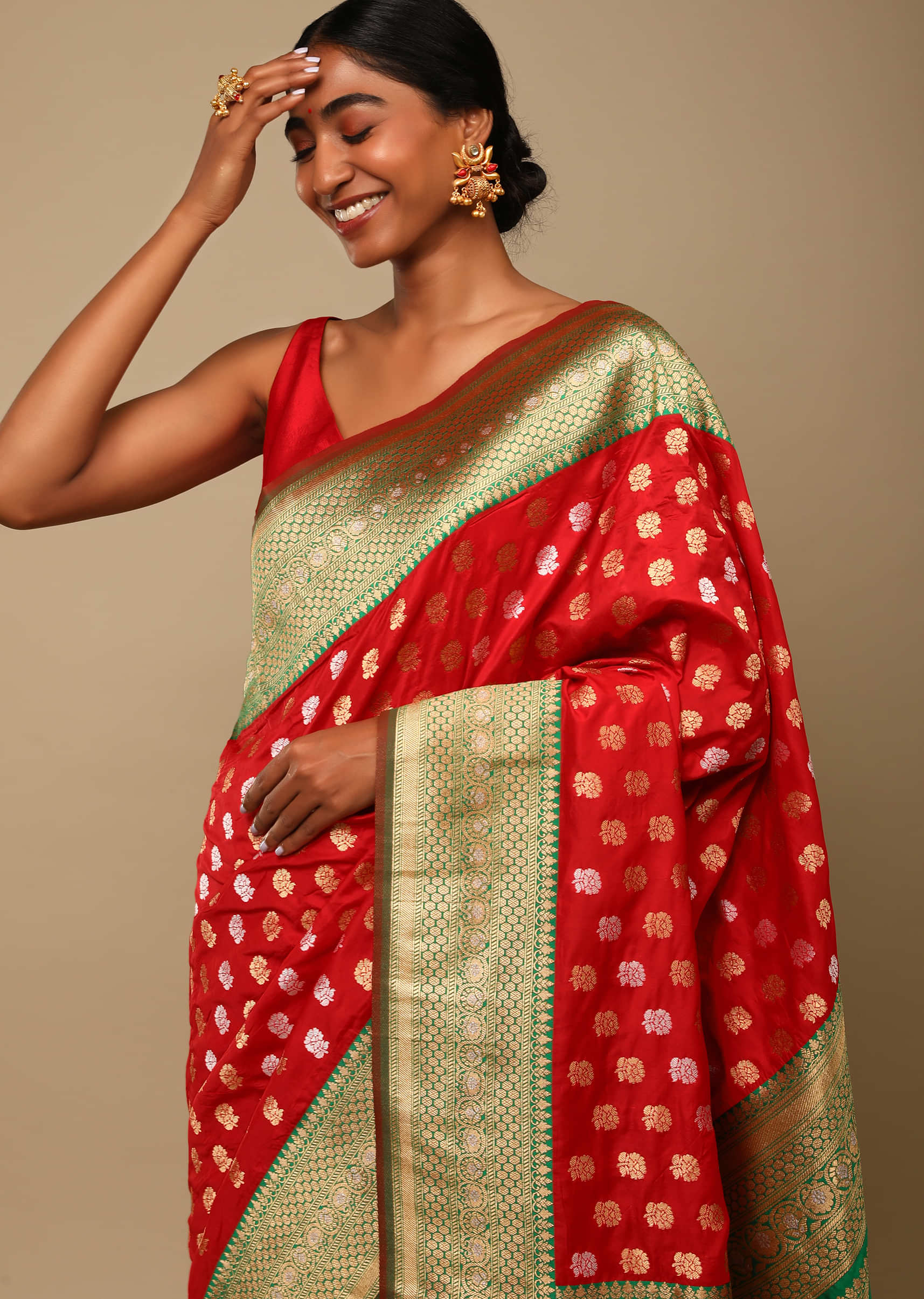 Vermillion Red Saree In Art Handloom Silk With Green Woven Border And Two Toned Buttis Along With Unstitched Blouse  