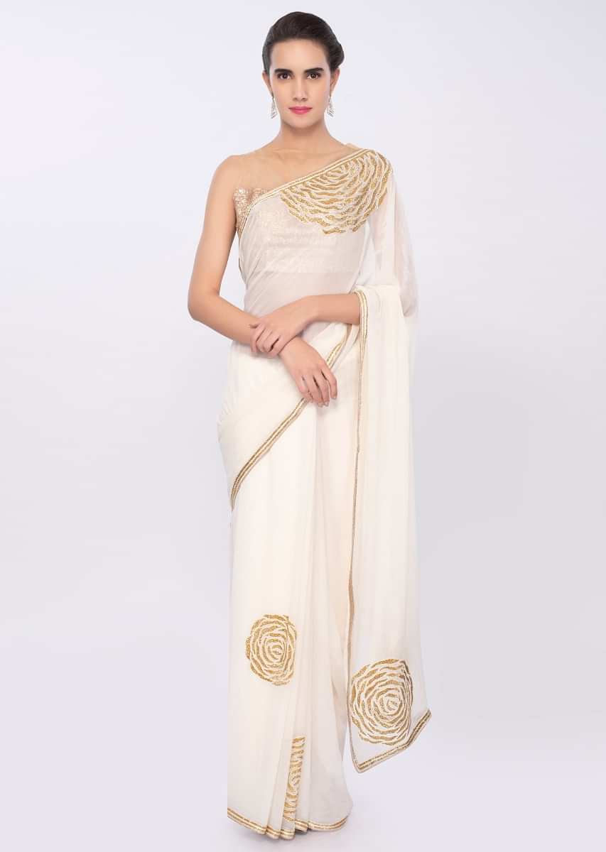 White chiffon saree with cut dana embroidery and butti only on Kalki