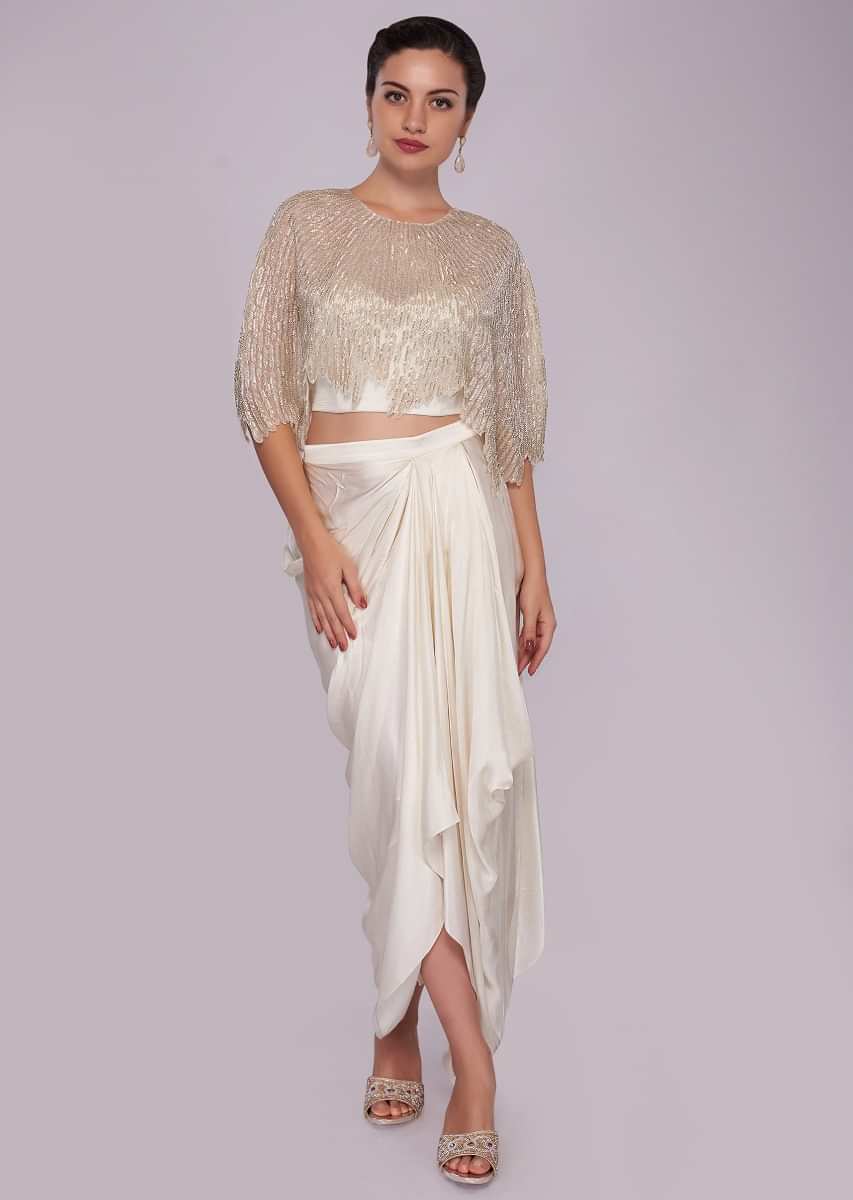 White fancy skirt paired with cut dana embroidered cape blouse 