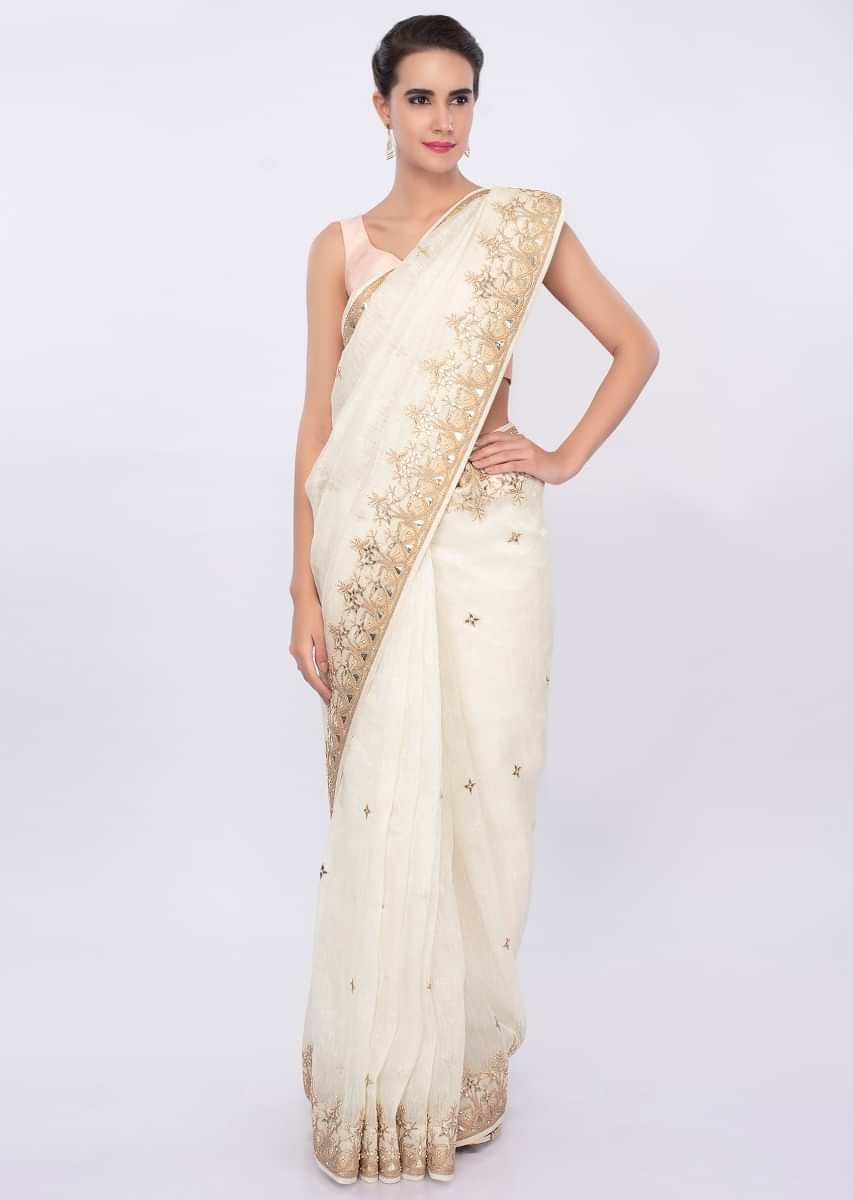 White linen saree with embroidered butti and border only on Kalki