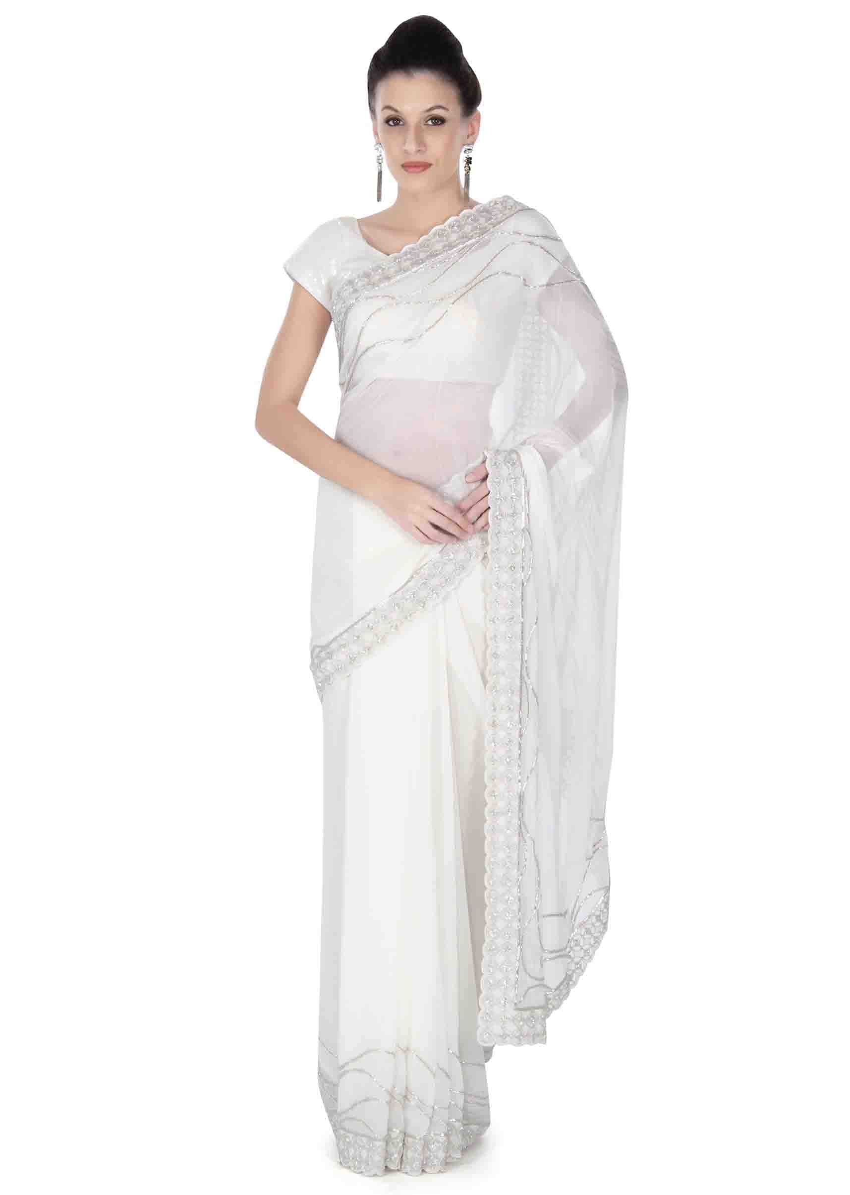 White saree in embroidered butti and border only on Kalki