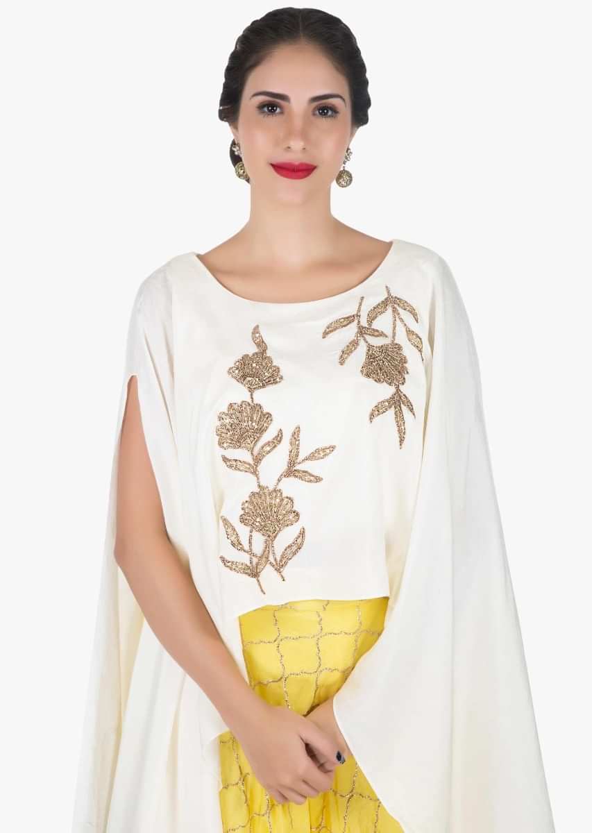 White and yellow skirt and top embellished in zari and zardosi embroidery work only on Kalki
