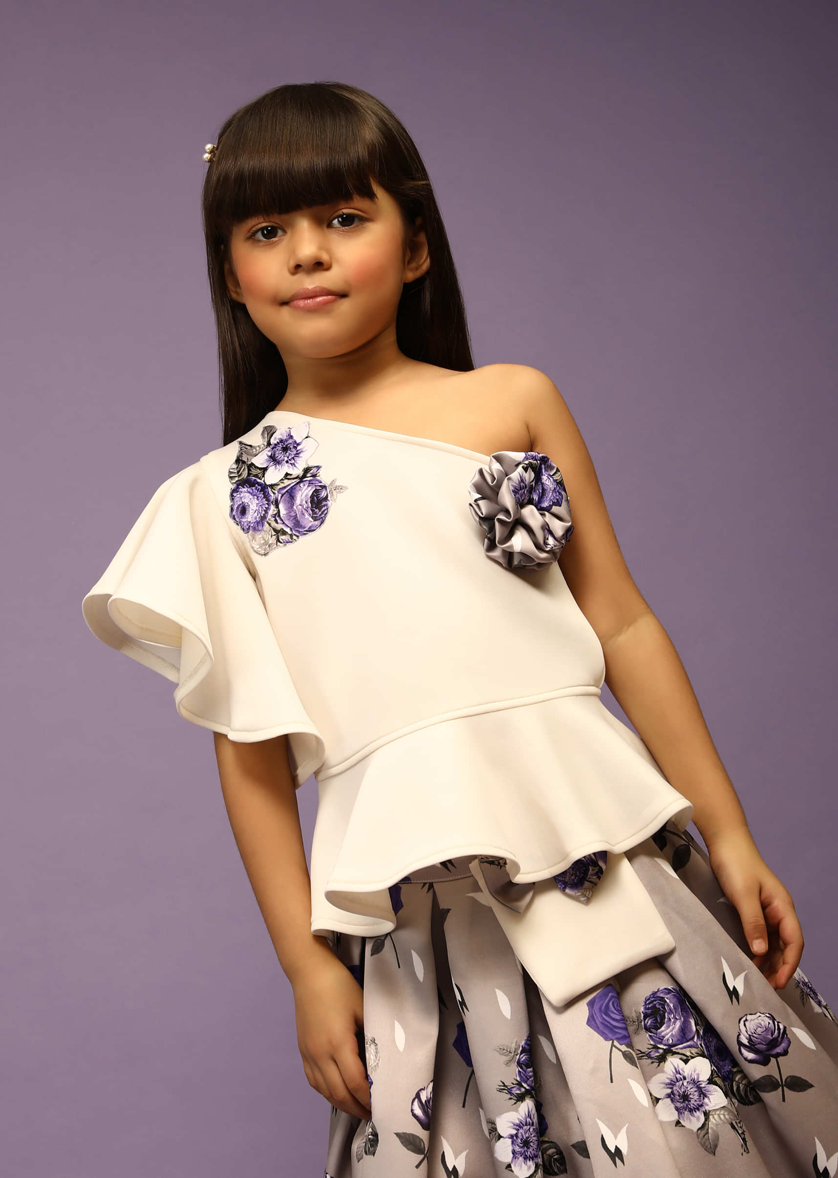 Kalki Girls White Peplum Top With One Shoulder Ruffle Sleeves And Grey Floral Printed Skirt  