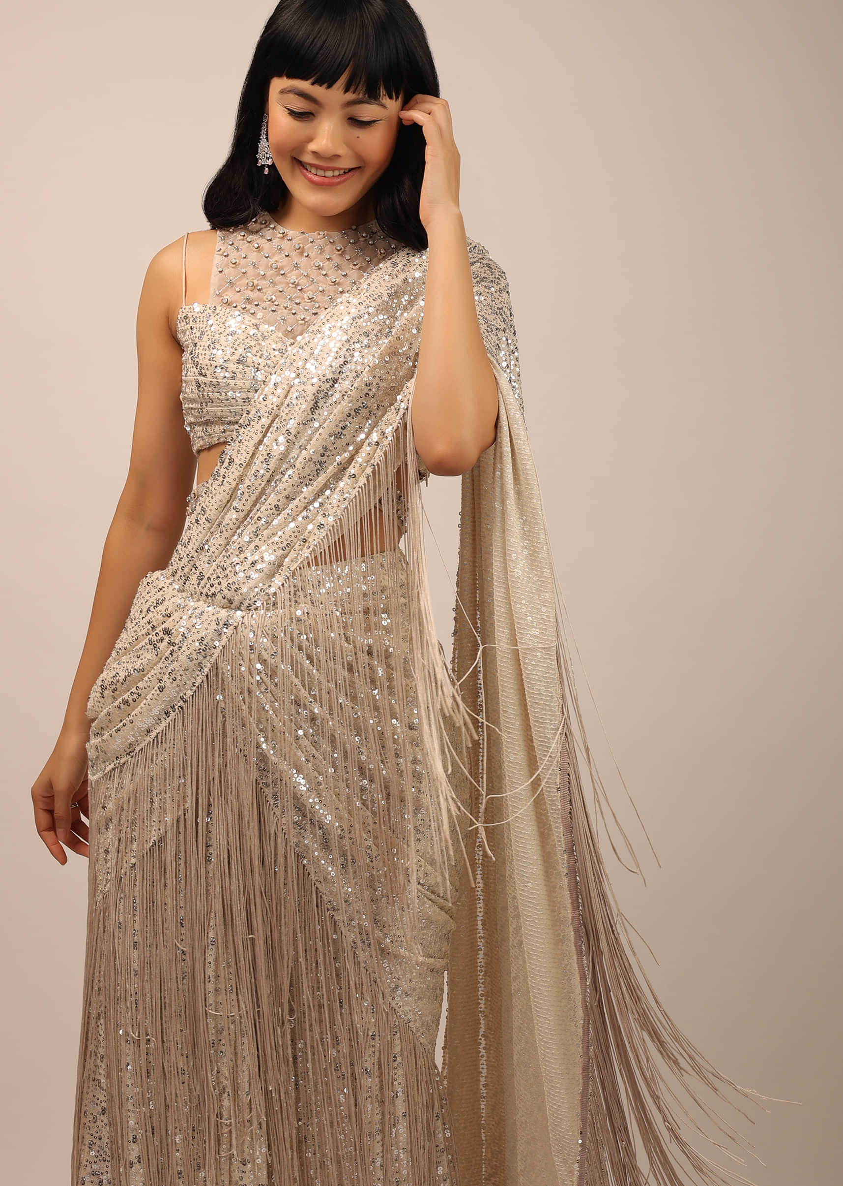 White Sequins Saree With A Fringe Border And Blouse With A Fancy Neckline