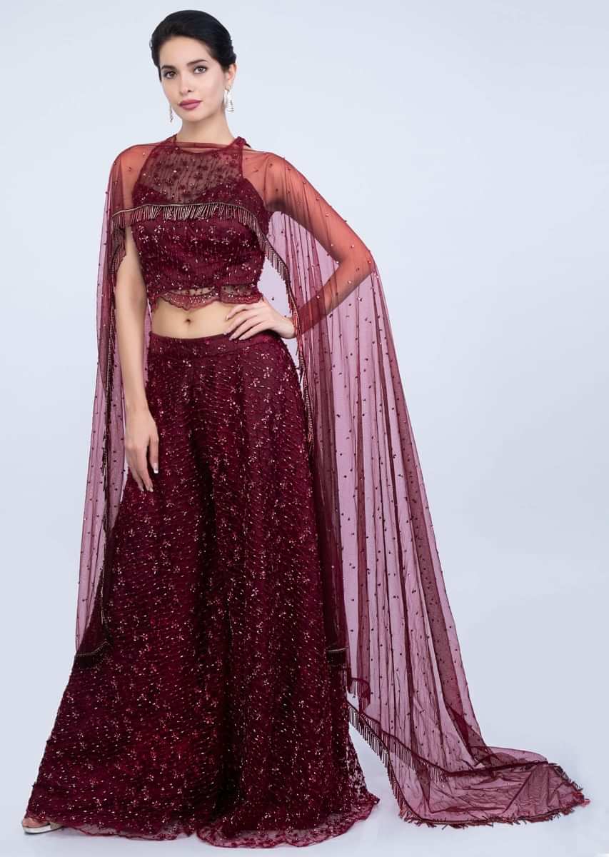 Wine Palazzo And Crop Top In Embroidered Net With Fancy Flared Cape Online - Kalki Fashion