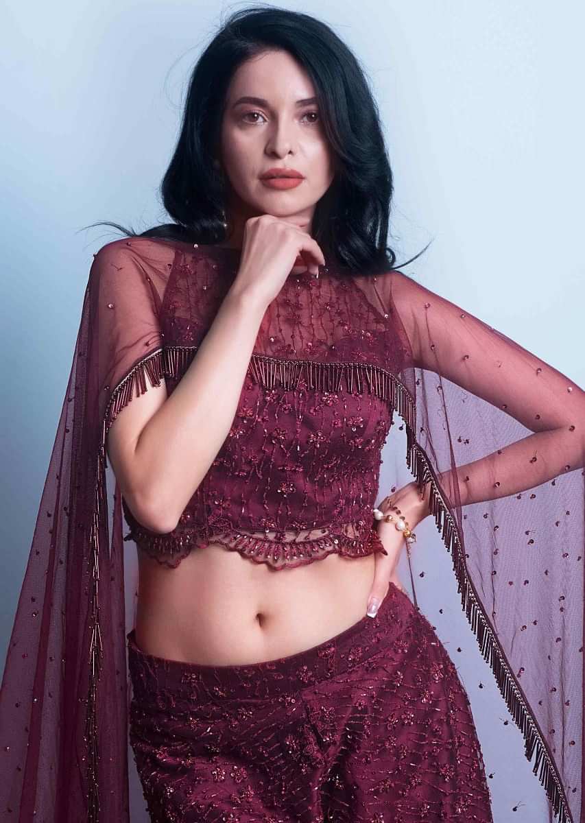 Wine Palazzo And Crop Top In Embroidered Net With Fancy Flared Cape Online - Kalki Fashion