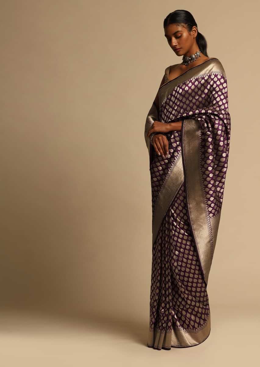 Wine Purple Banarasi Saree In Pure Handloom Silk With Woven Floral Buttis And Chevron Border Along With Unstitched Blouse Piece  