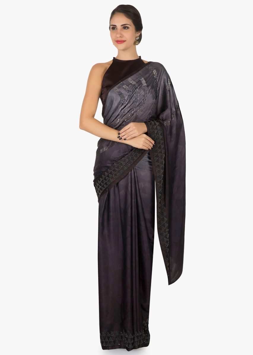 Wine and grey shaded saree in satin with unstitched blouse crafted in kundan embroidery work only on Kalki