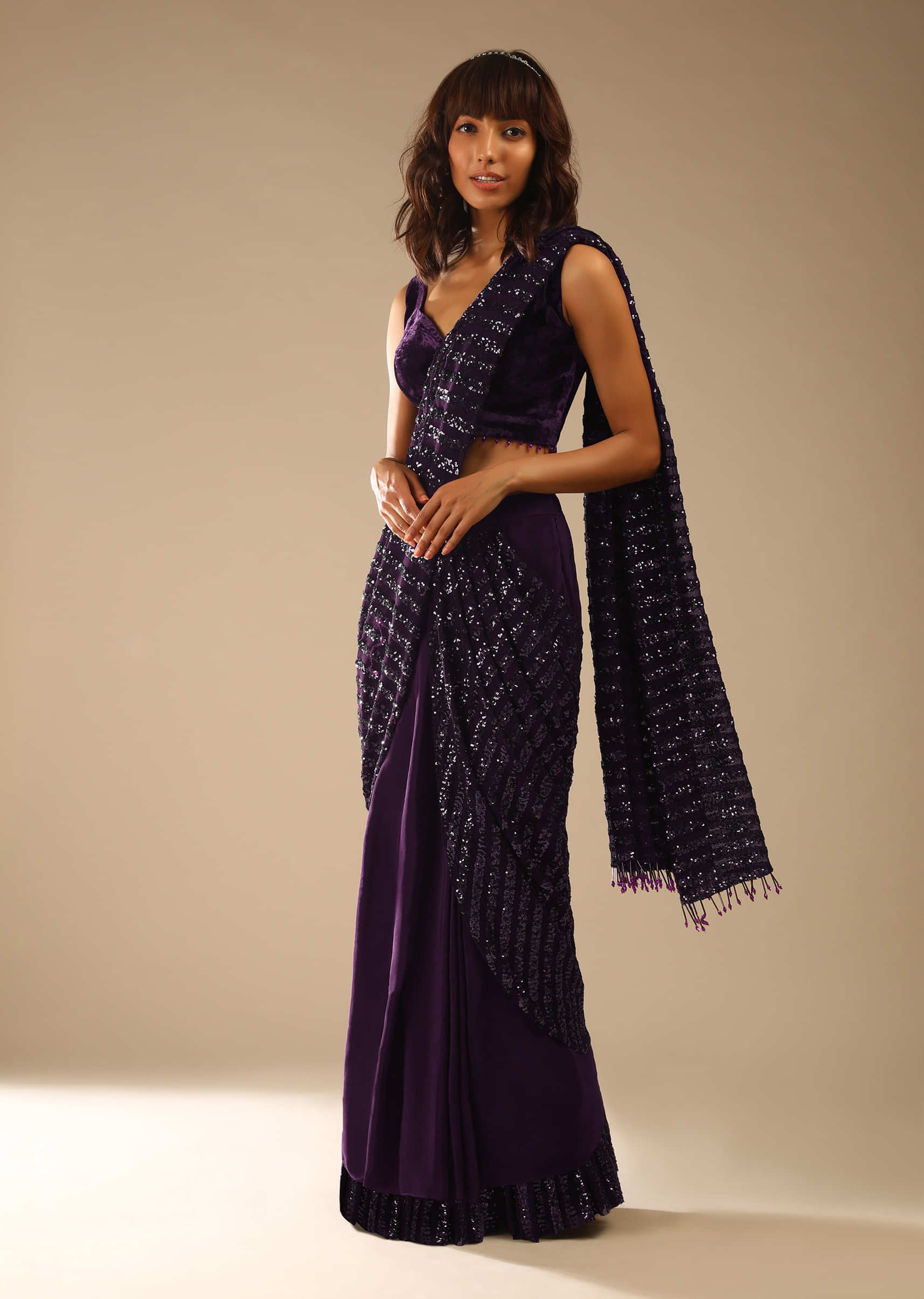 Wine Purple Ready Pleated Saree In Crepe With Striped Sequins Pallu And Matching Velvet Blouse With Bead Tassels  