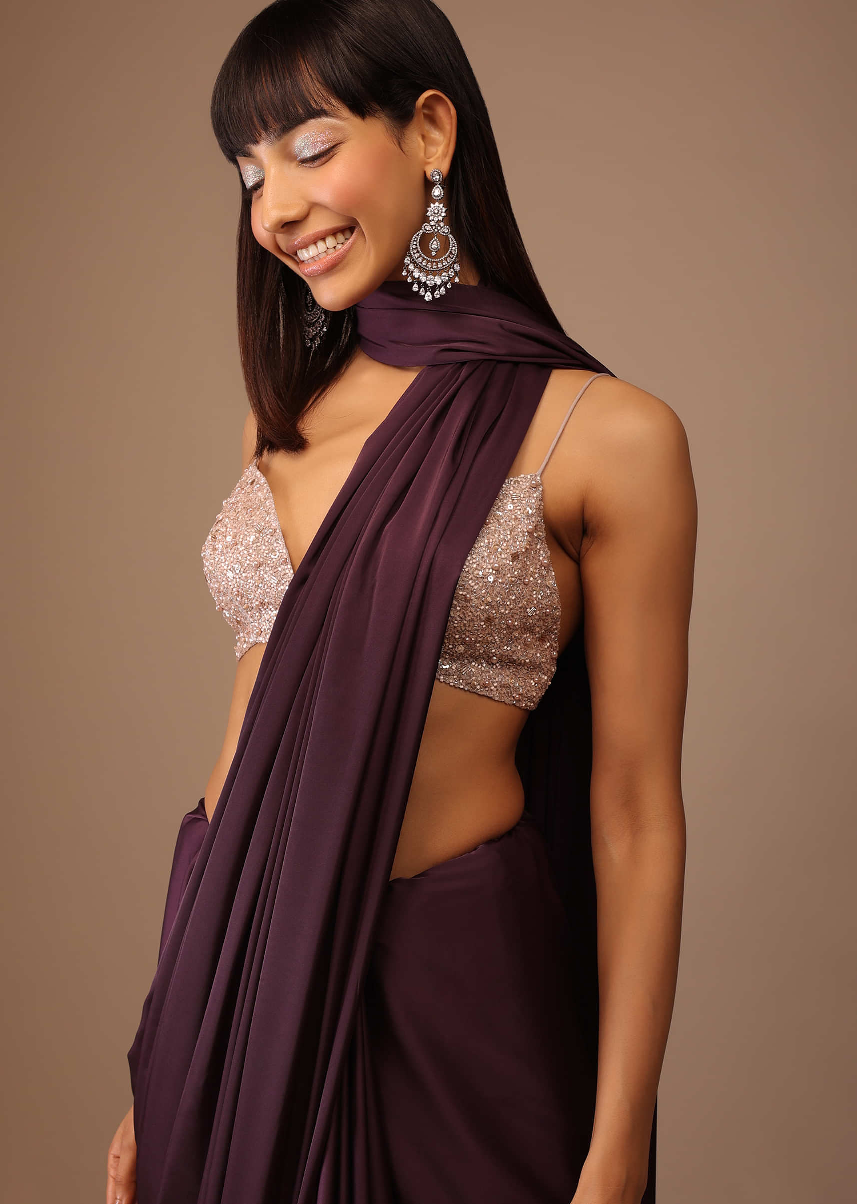 Wine Satin Saree With Fringes On Pallu Paired With Hand Embroidered Bustier