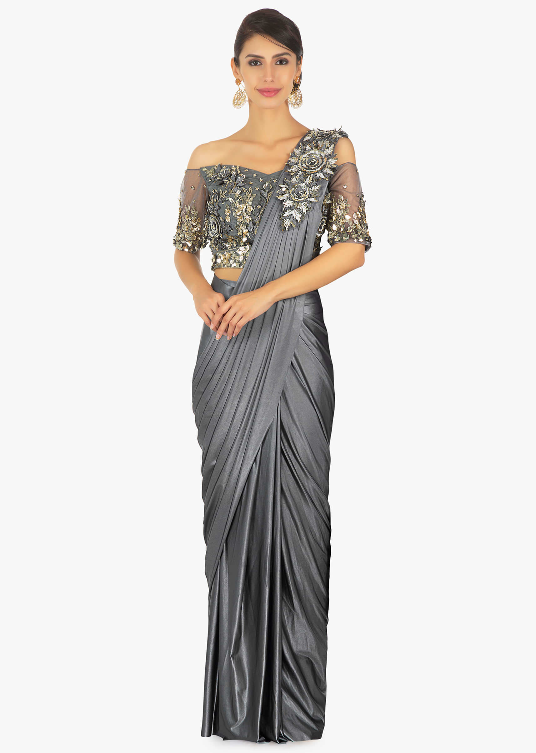 Wrap around lycra saree with presstitched pleats and pallo paired with an embellished net blouse