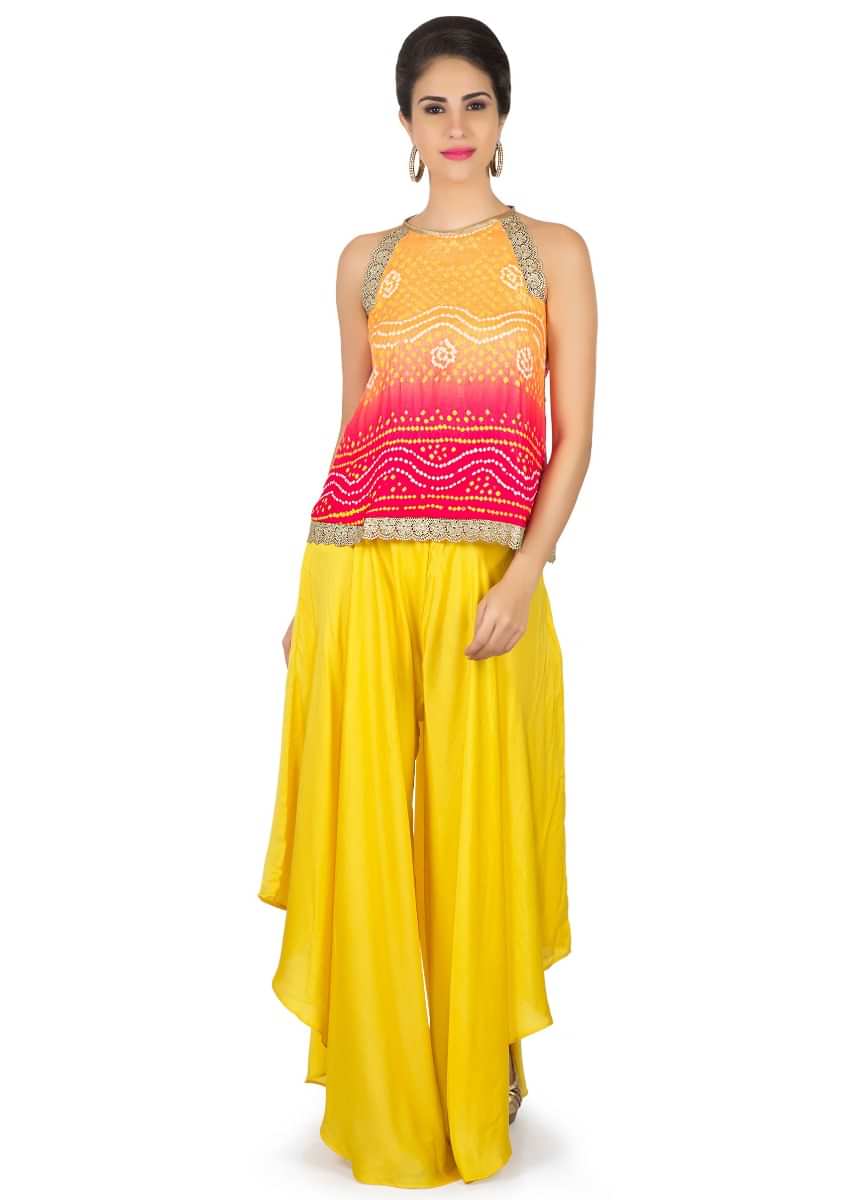 Orange and red bandhani top with yellow fancy palazzo pant only on Kalki