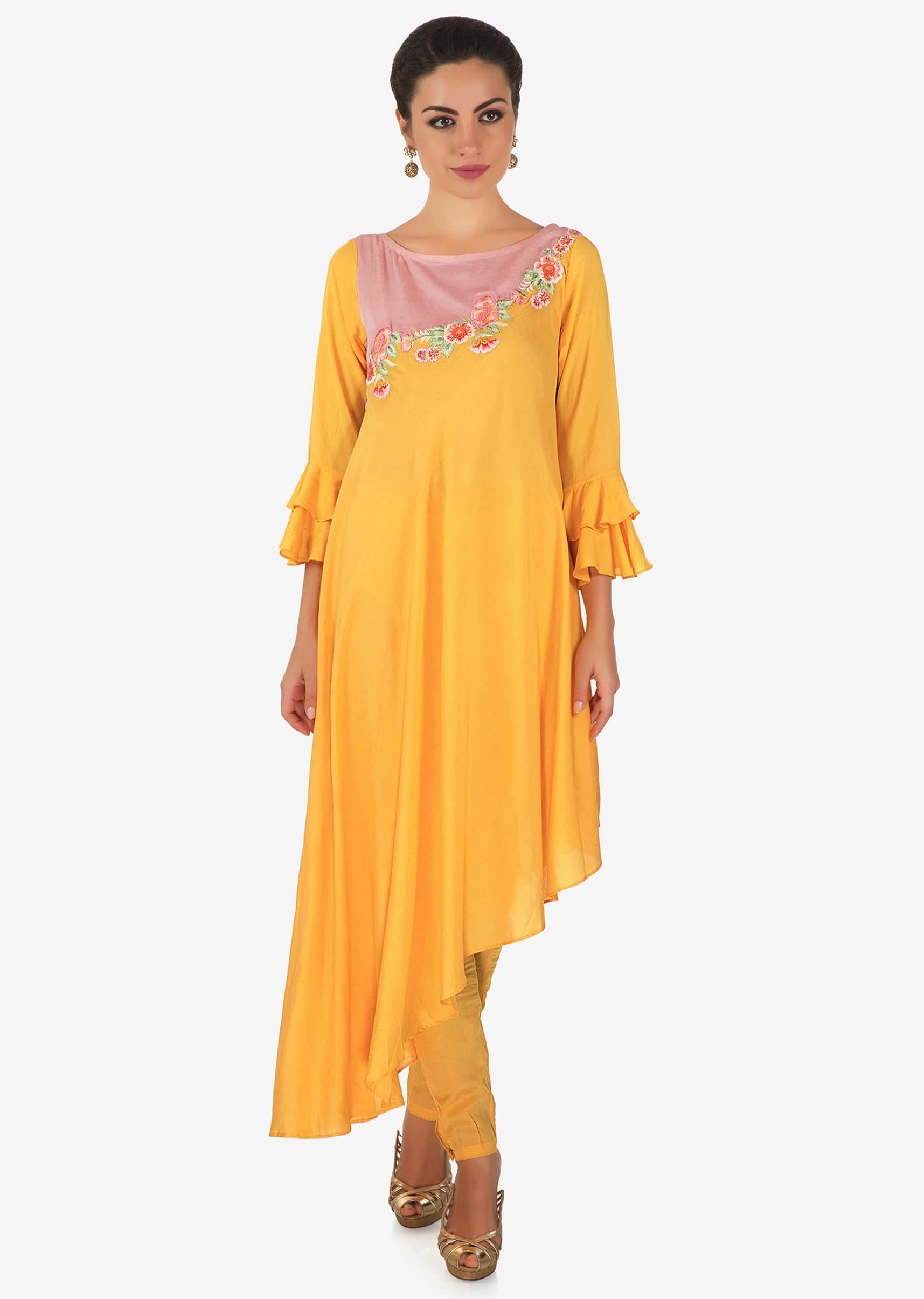 Yellow asymmetric suit with pink yoke embellished in resham and french knot work only on Kalki