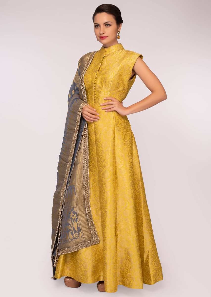 Yellow brocade anarkali dress matched with a grey georgette weaved ...