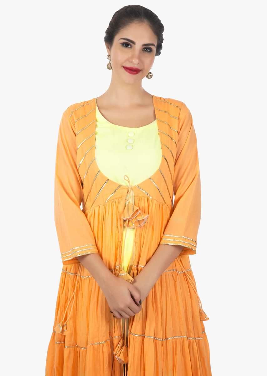 Yellow cotton kurti pant paired with apricot jacket with gathers