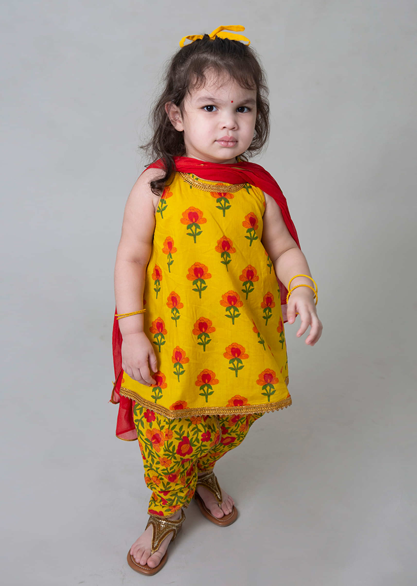 Kalki Girls Yellow Dhoti Suit In Cotton With Floral Printed Buttis And Jaal Design By Tiber Taber