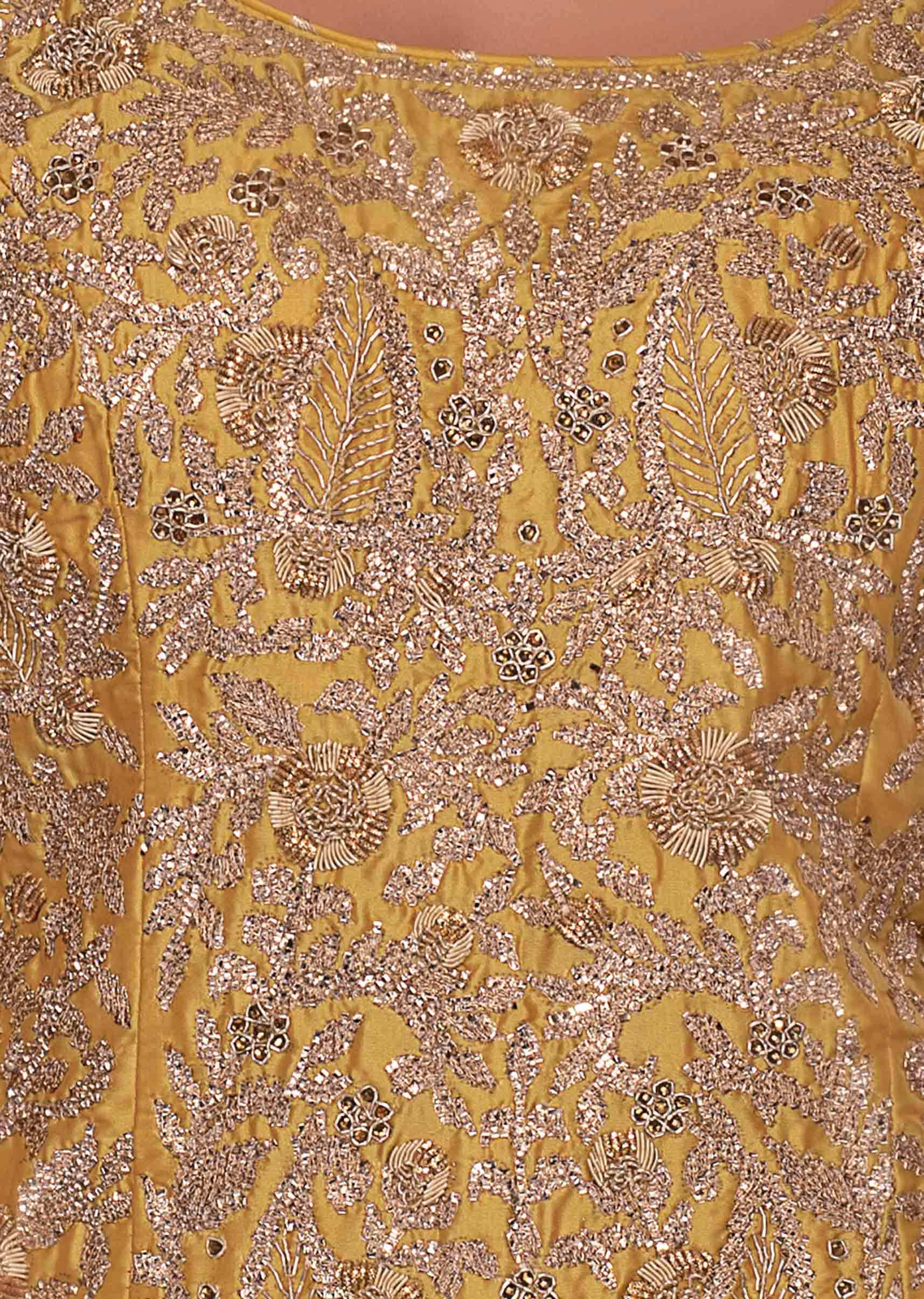 Yellow silk embroidered suit with matching sharara pant and net dupatta 