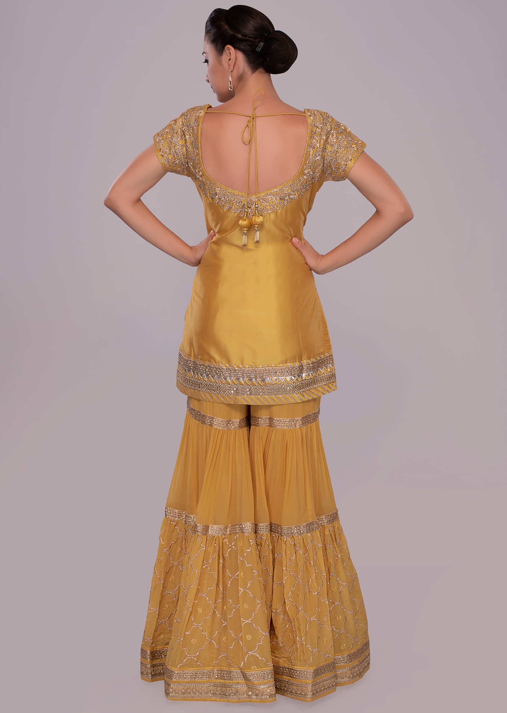 Yellow silk embroidered suit with matching sharara pant and net dupatta 