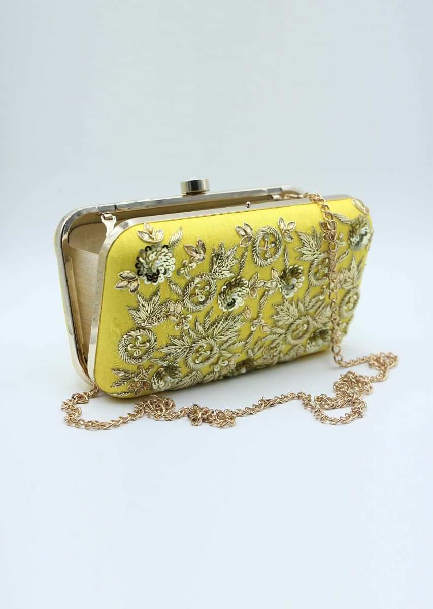 Yellow sling clutch bag embellished in zardosi floral embroidery 