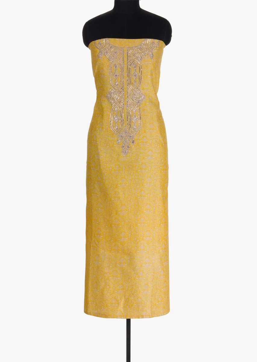 Yellow unstitched silk suit in print with gotta lace embroidered neckline and placket 