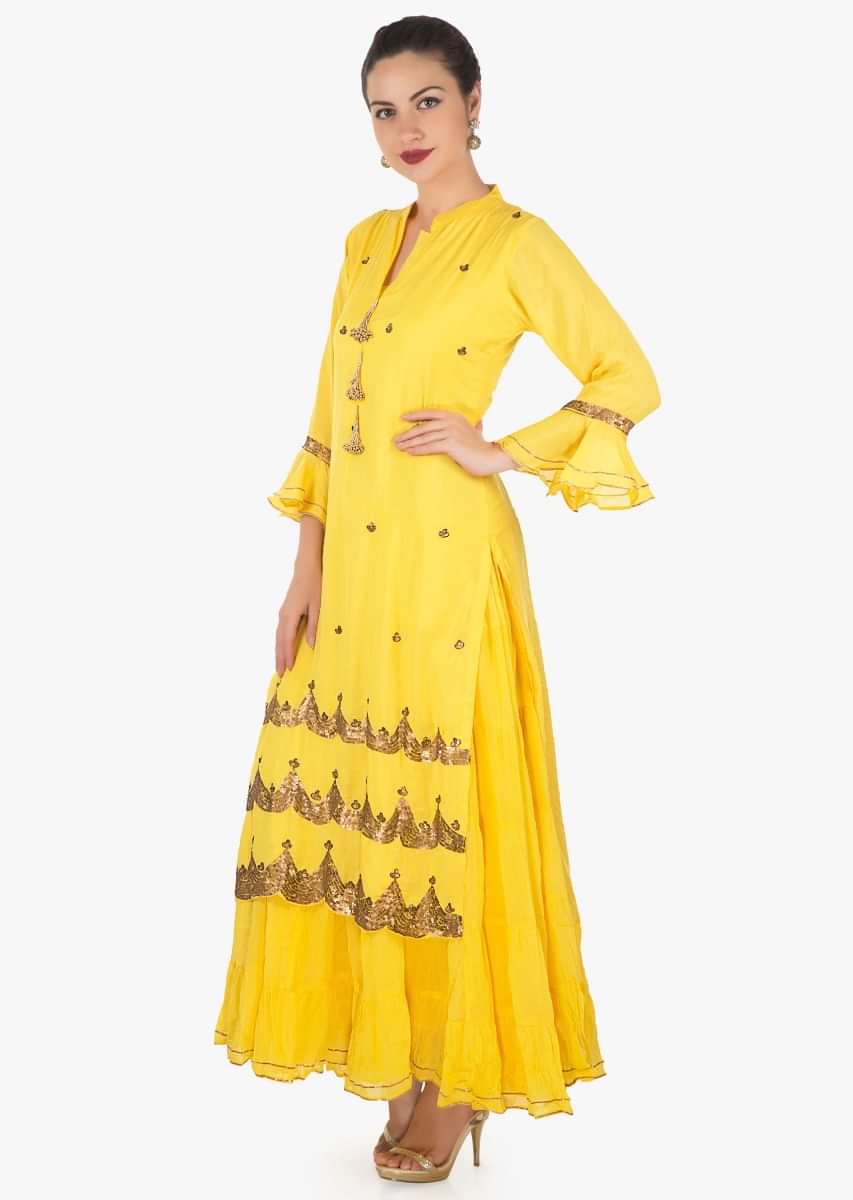 Yellow double layer dress in cotton embellished in fancy tassel and sequin embroidery only on Kalki