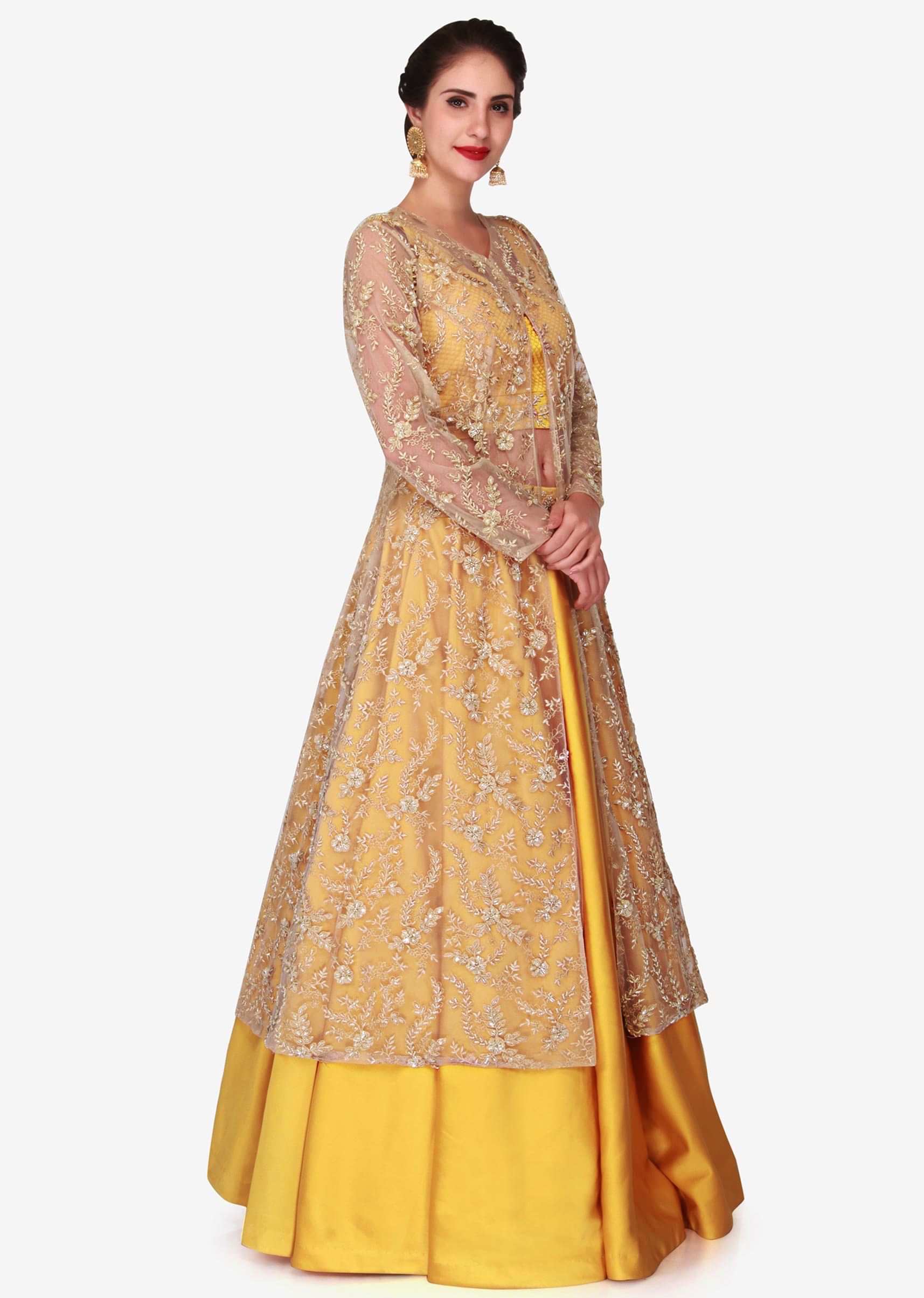 Yellow lehenga with beige jacket featuring the moti and cut dana embroidery work only on Kalki